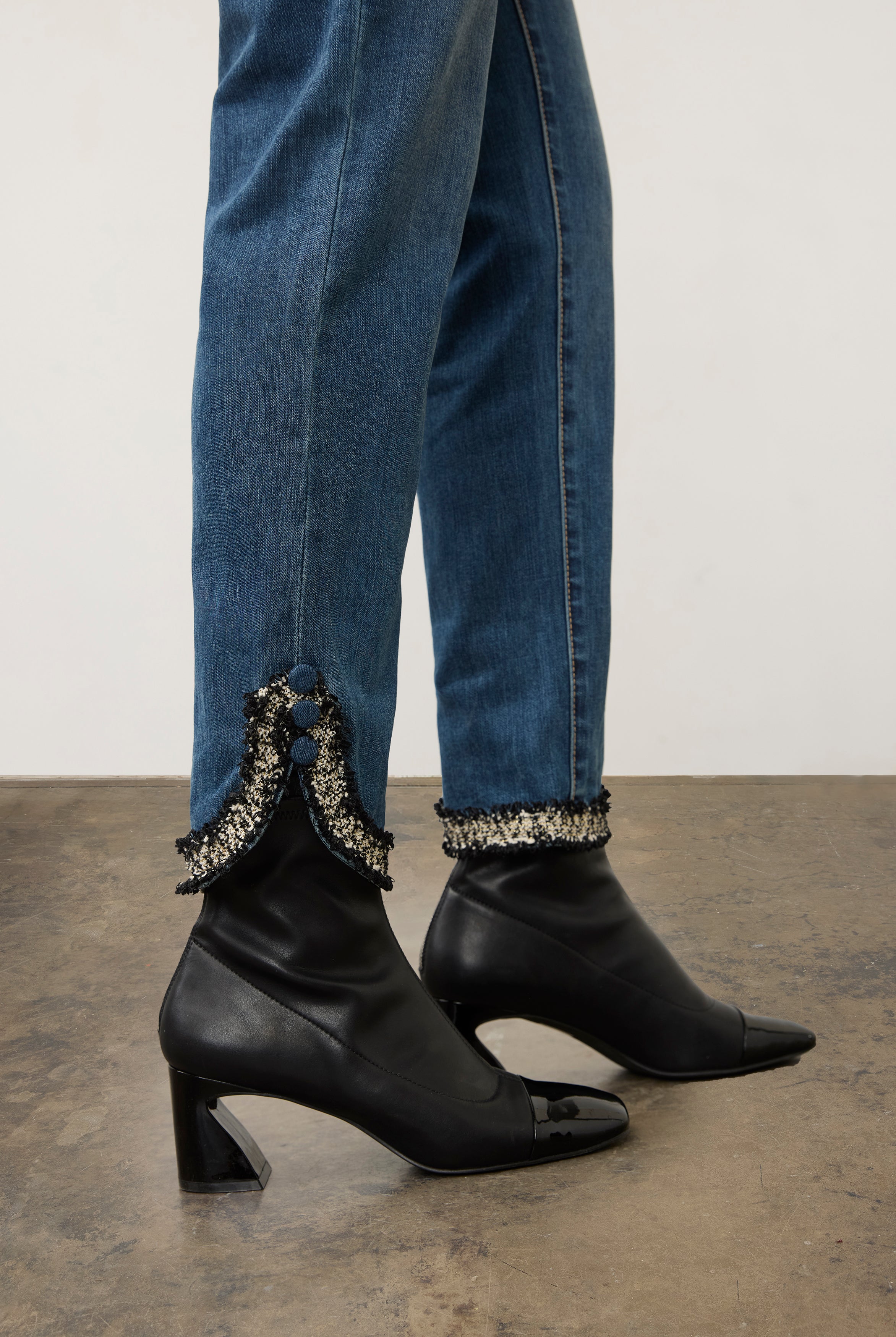 Side view of medium blue Olivia denim highlighting buttoned slit cuffs by French Dressing Jeans (FDJ)