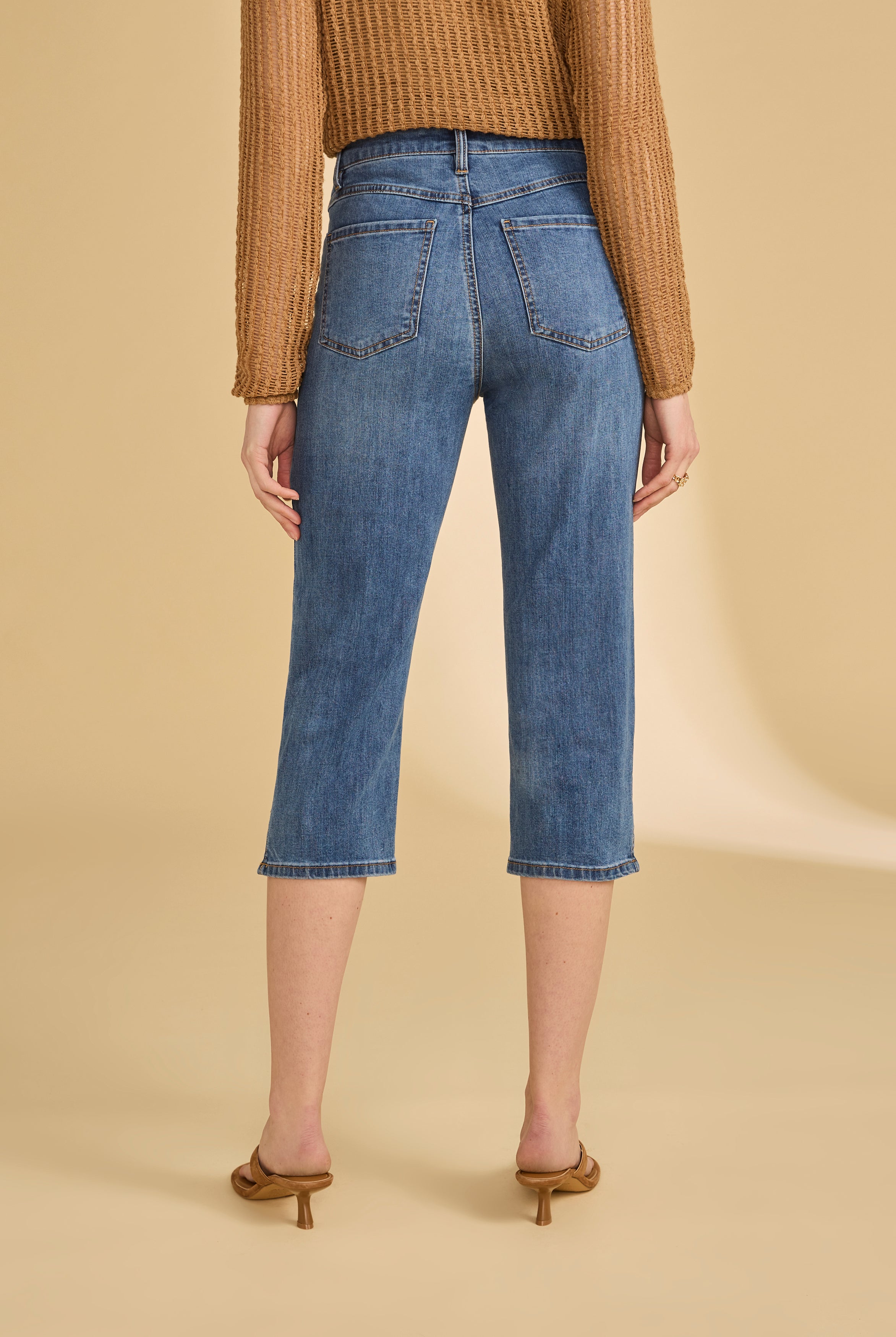 Back view of darker indigo blue cropped jeans highlighting rear pockets by French Dressing Jeans (FDJ)