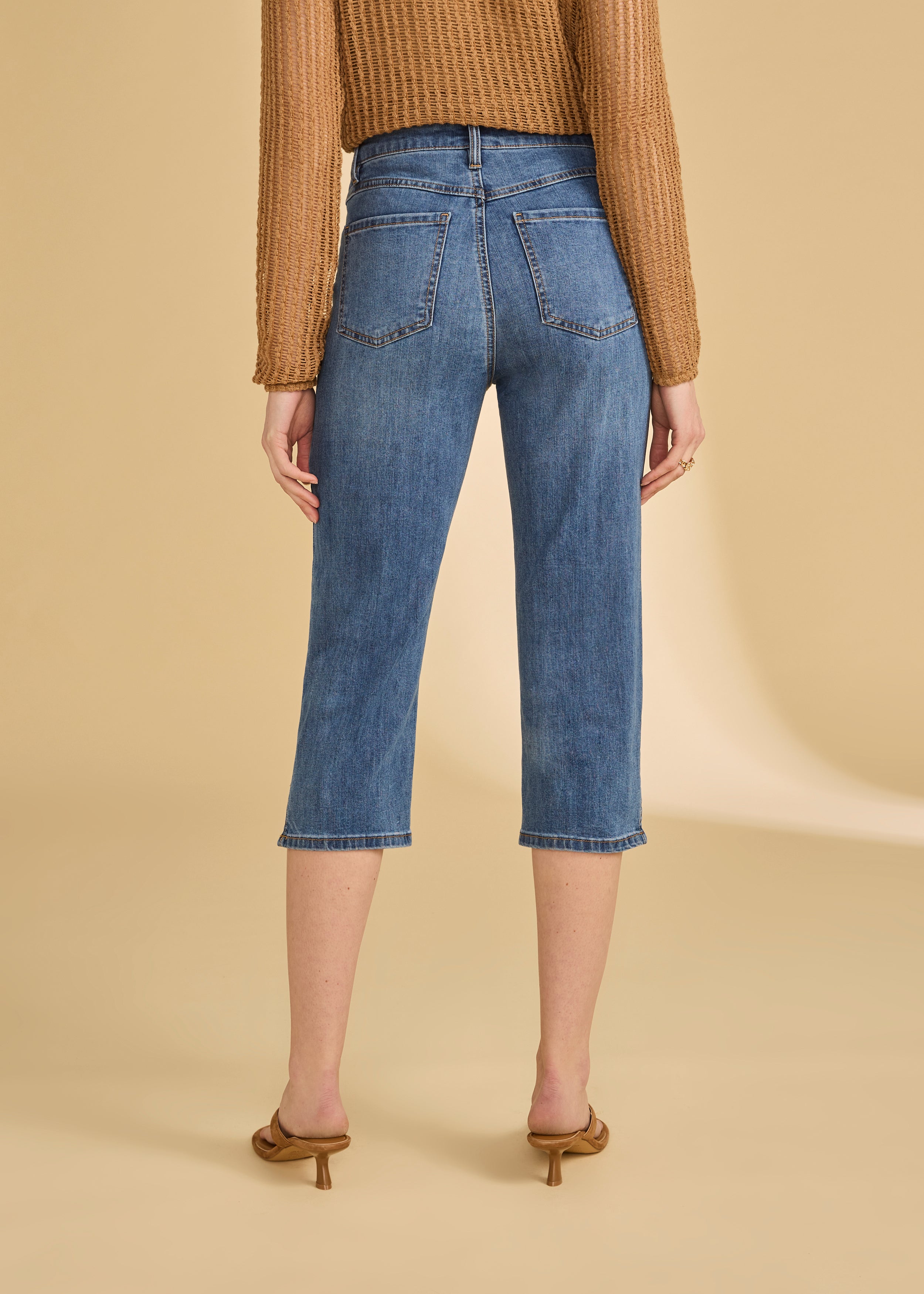 Back view of darker indigo blue cropped jeans highlighting rear pockets by French Dressing Jeans (FDJ)