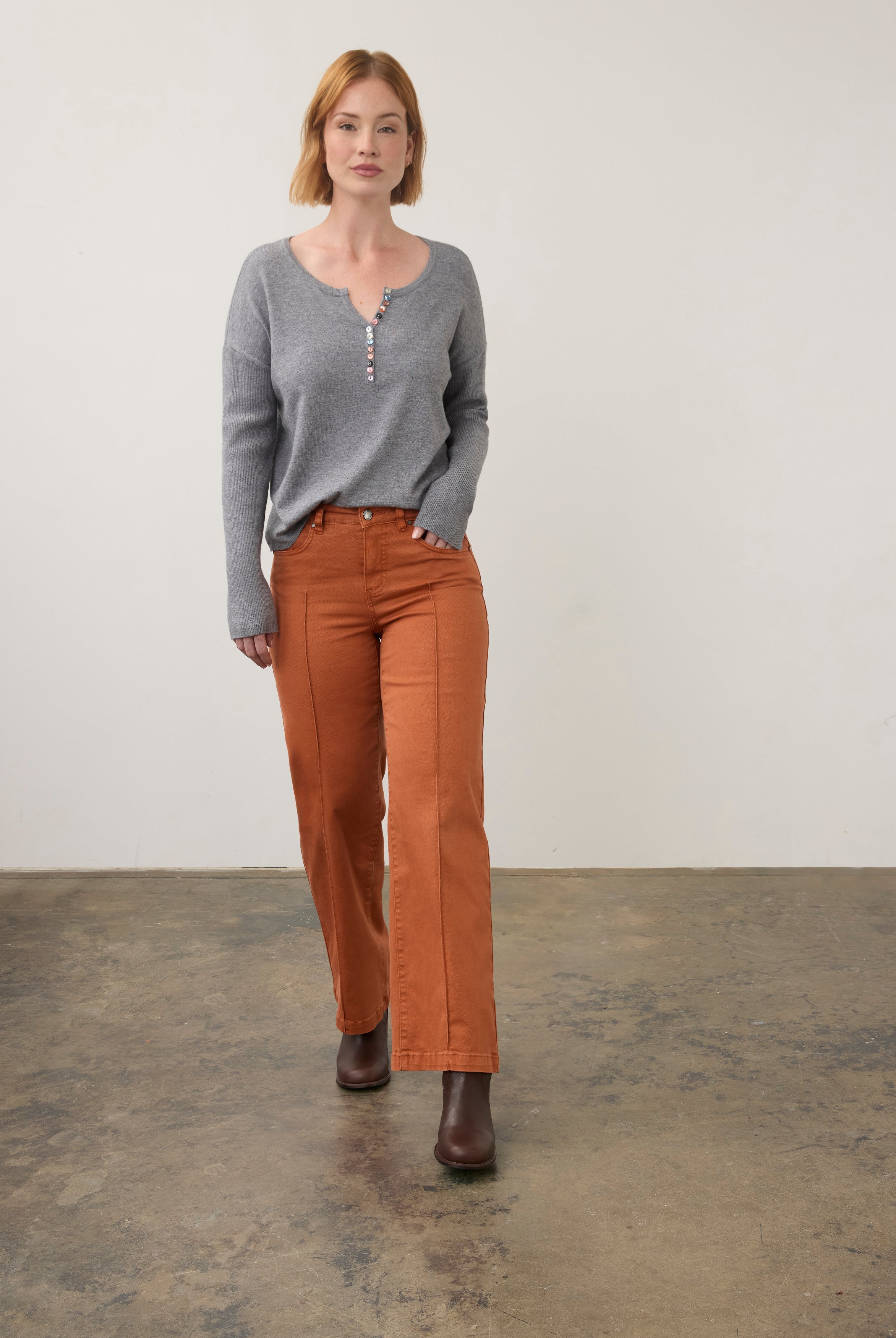 Full view of grey sweater paired with orange pants by French Dressing Jeans (FDJ)