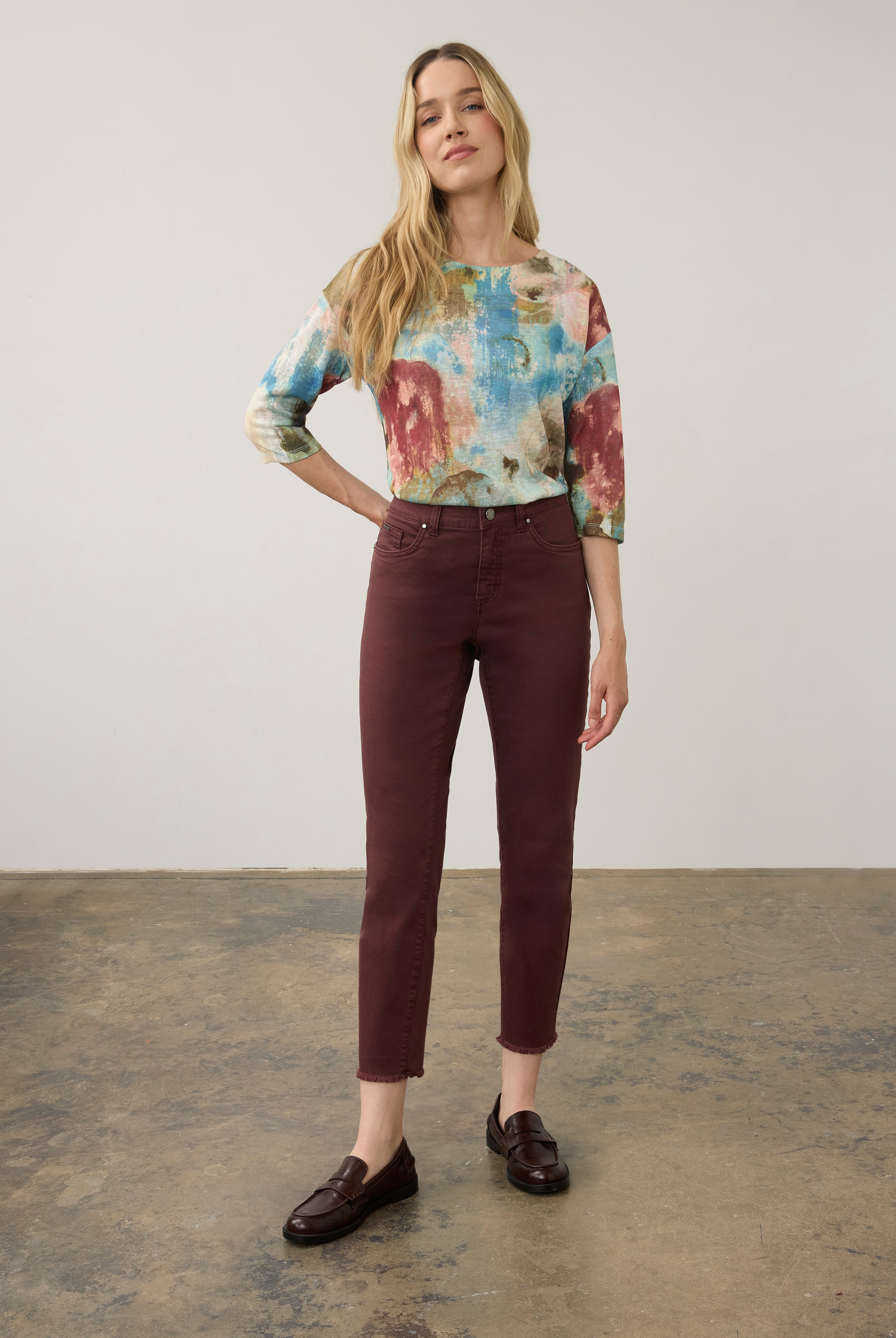 Full body view of vibrant pastel Henley top with burgundy pants and loafers by French Dressing Jeans (FDJ)