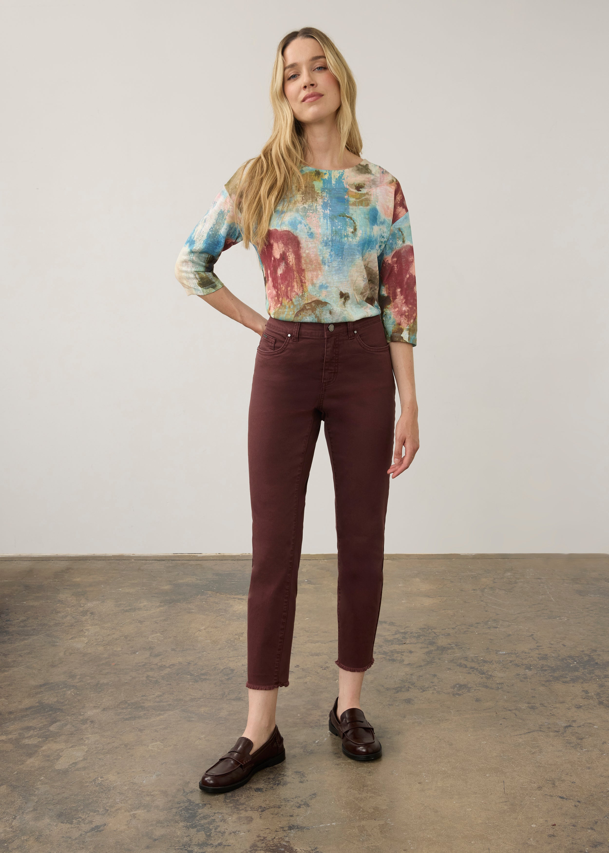 Full body view of vibrant pastel Henley top with burgundy pants and loafers by French Dressing Jeans (FDJ)