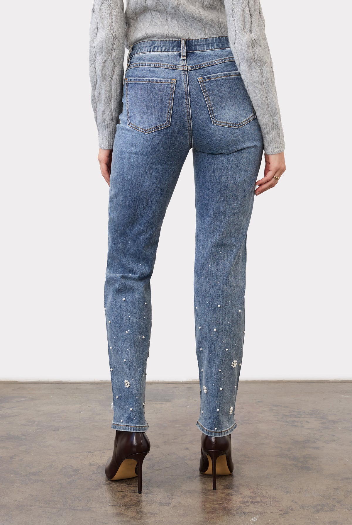 Back view of indigo jeans with pearl embellishments and patch pockets by French Dressing Jeans (FDJ)