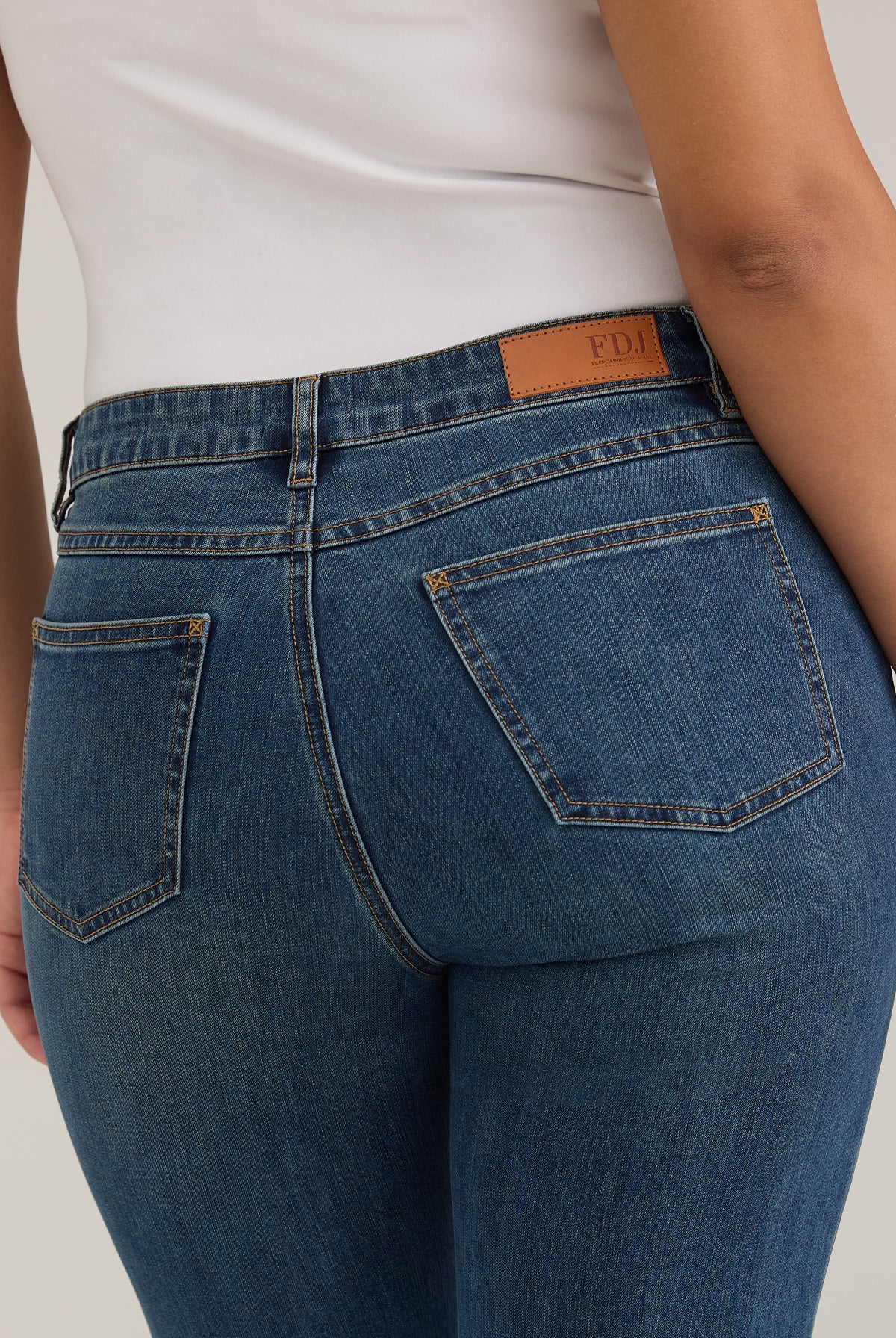Detail shot of back pockets and waistline on dark wash Olivia straight leg denim by French Dressing Jeans (FDJ)