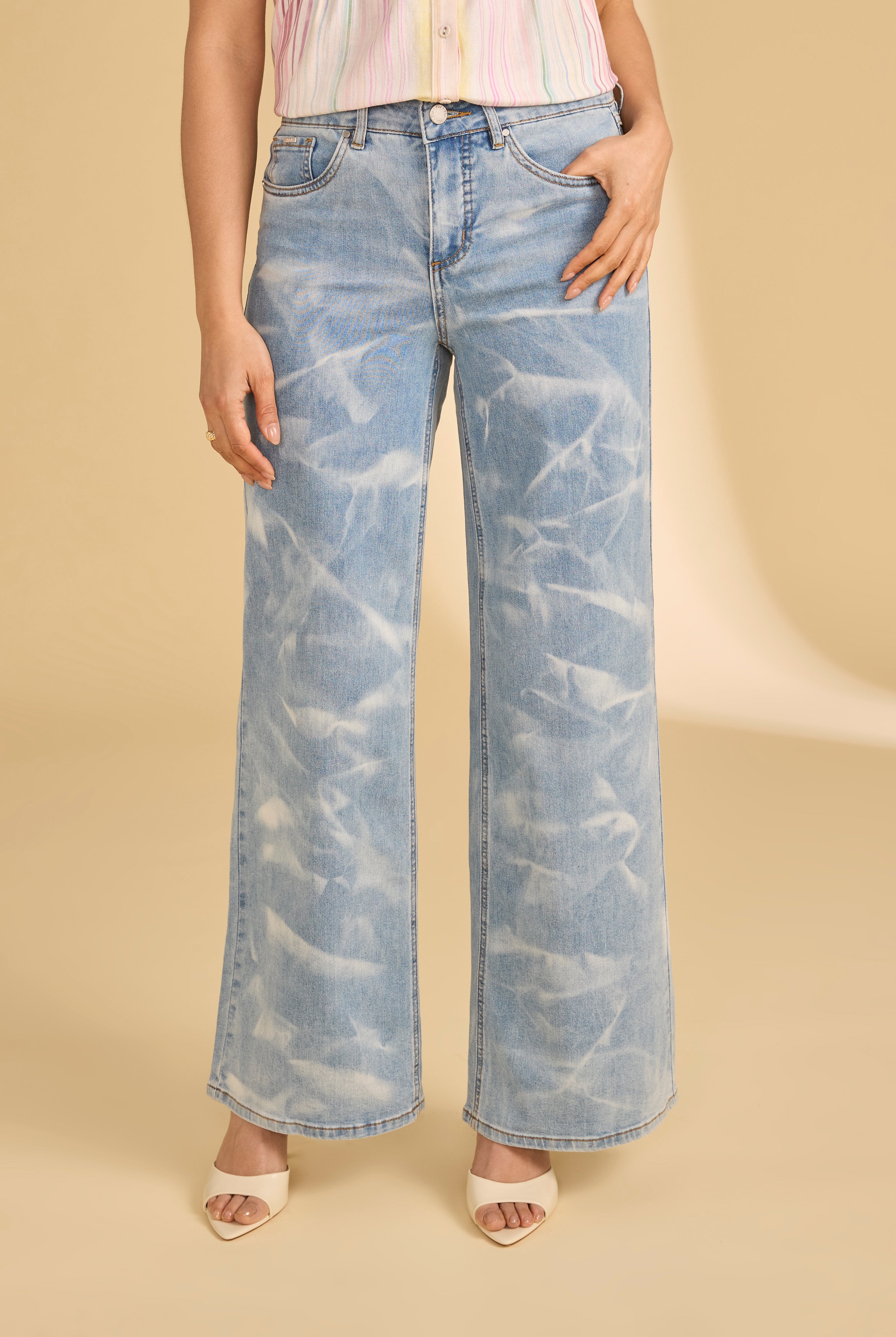 Close-up of light denim jeans with subtle pattern detail and front pocket by French Dressing Jeans (FDJ)