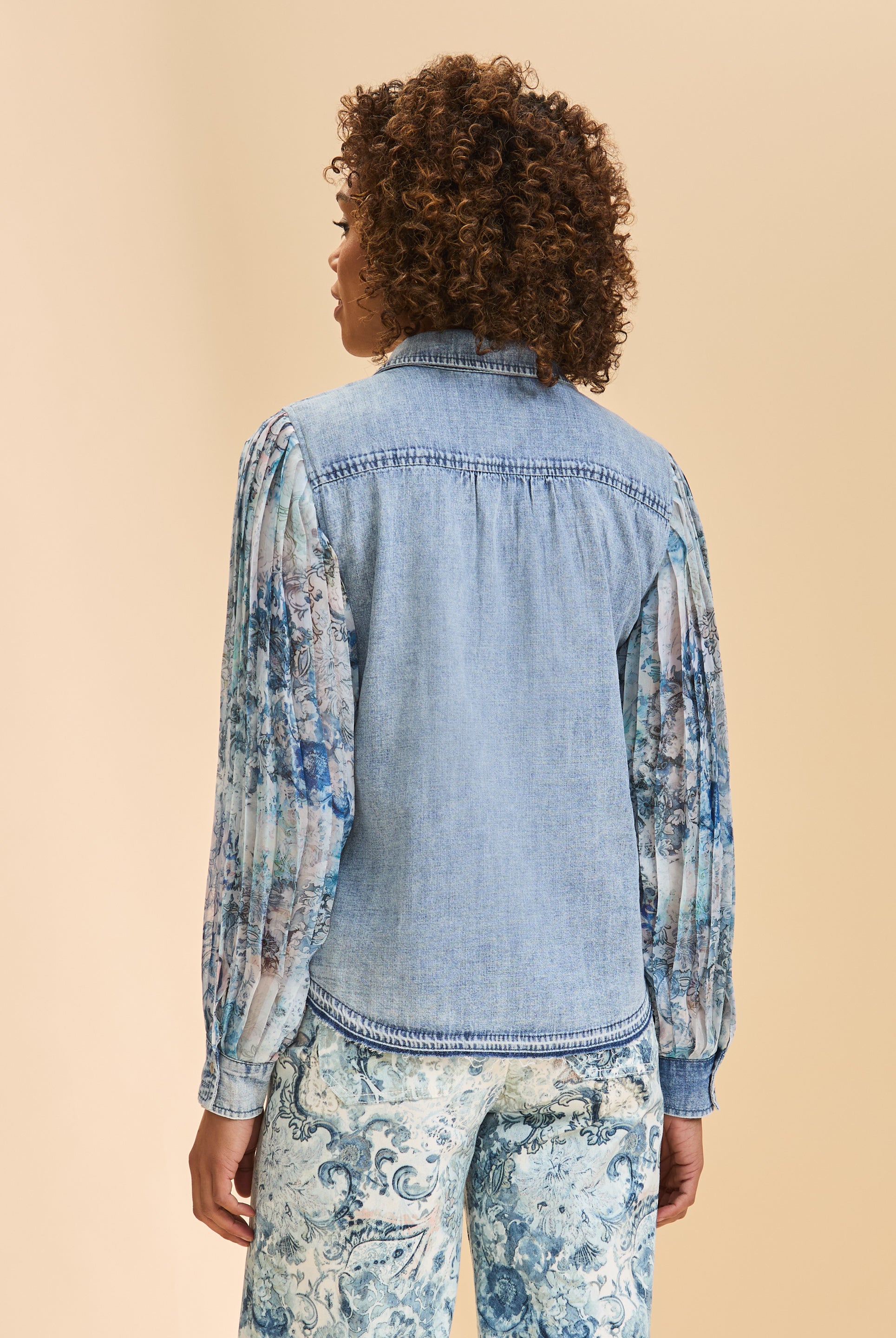 Back view of denim shirt with sheer floral sleeves and stitching detail by French Dressing Jeans (FDJ)