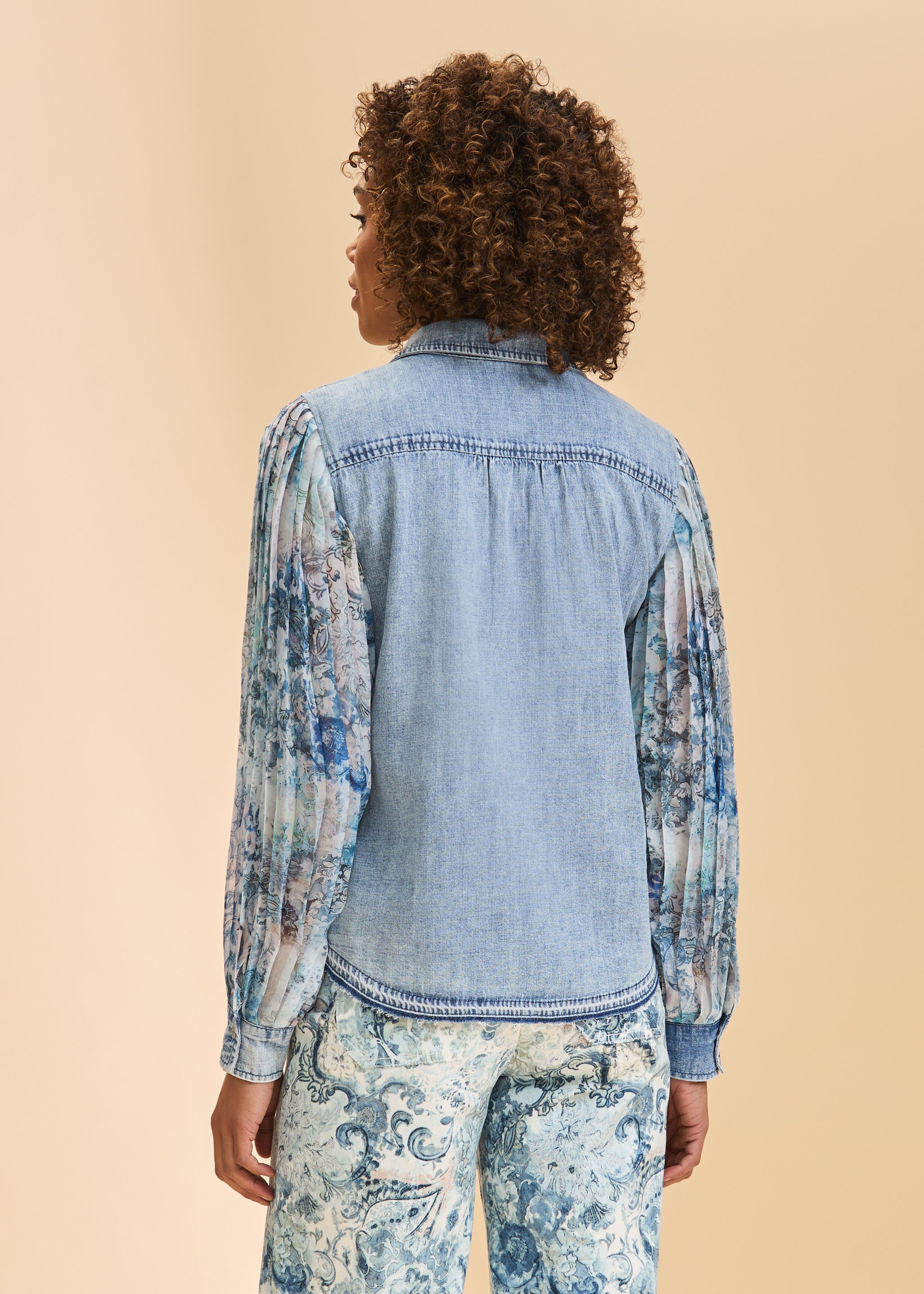 Back view of denim shirt with sheer floral sleeves and stitching detail by French Dressing Jeans (FDJ)