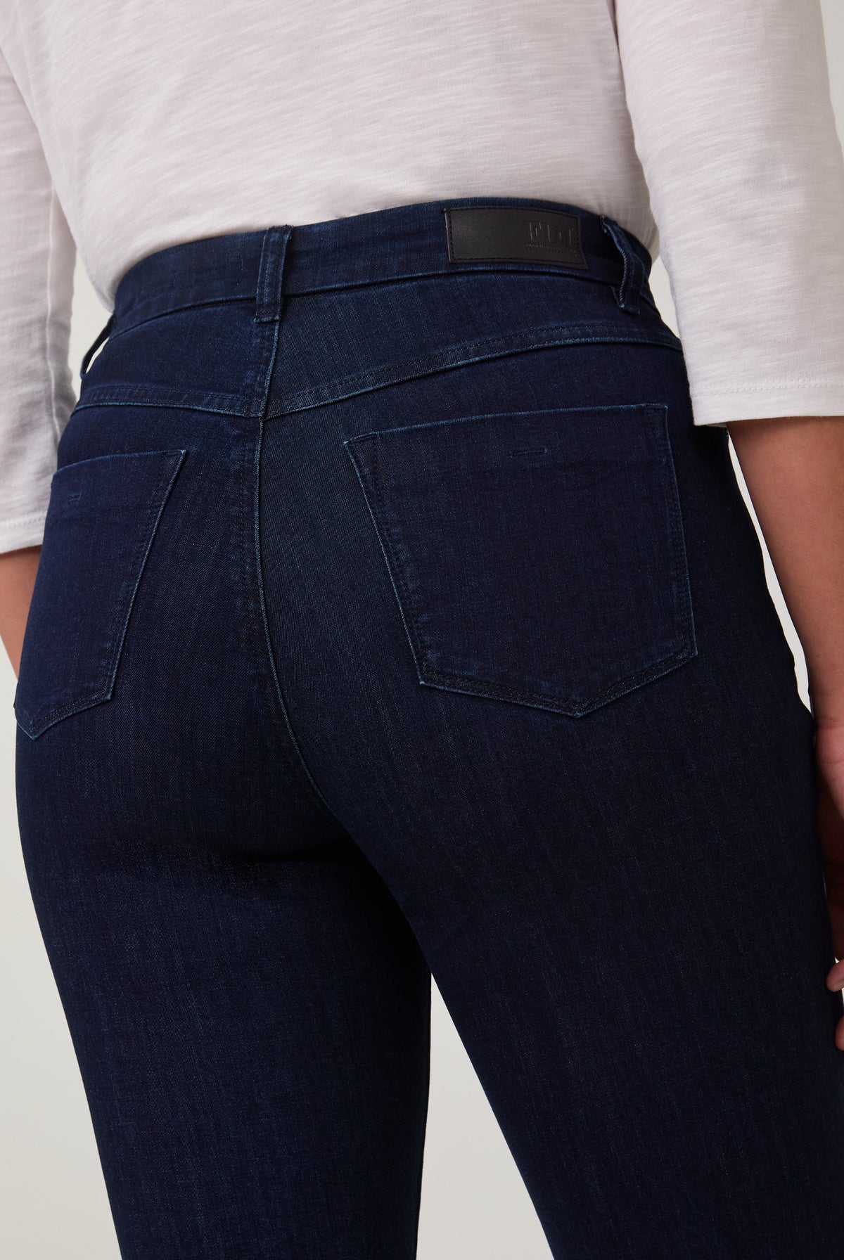 Detail of back pocket stitching on vibrant Delight jeans by French Dressing Jeans (FDJ)