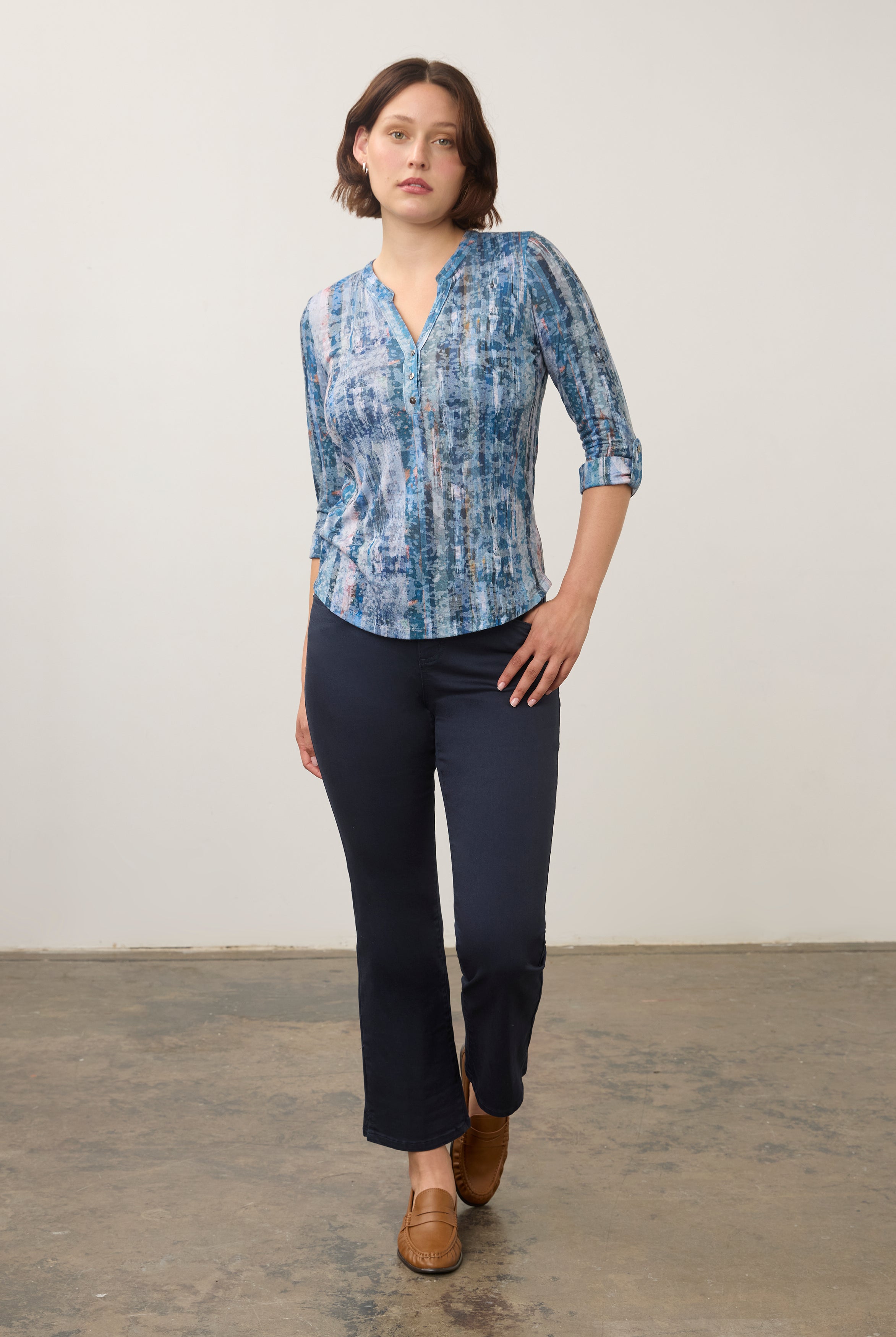 Full-body view of blue patterned 3/4 sleeve top paired with navy pants by French Dressing Jeans (FDJ)