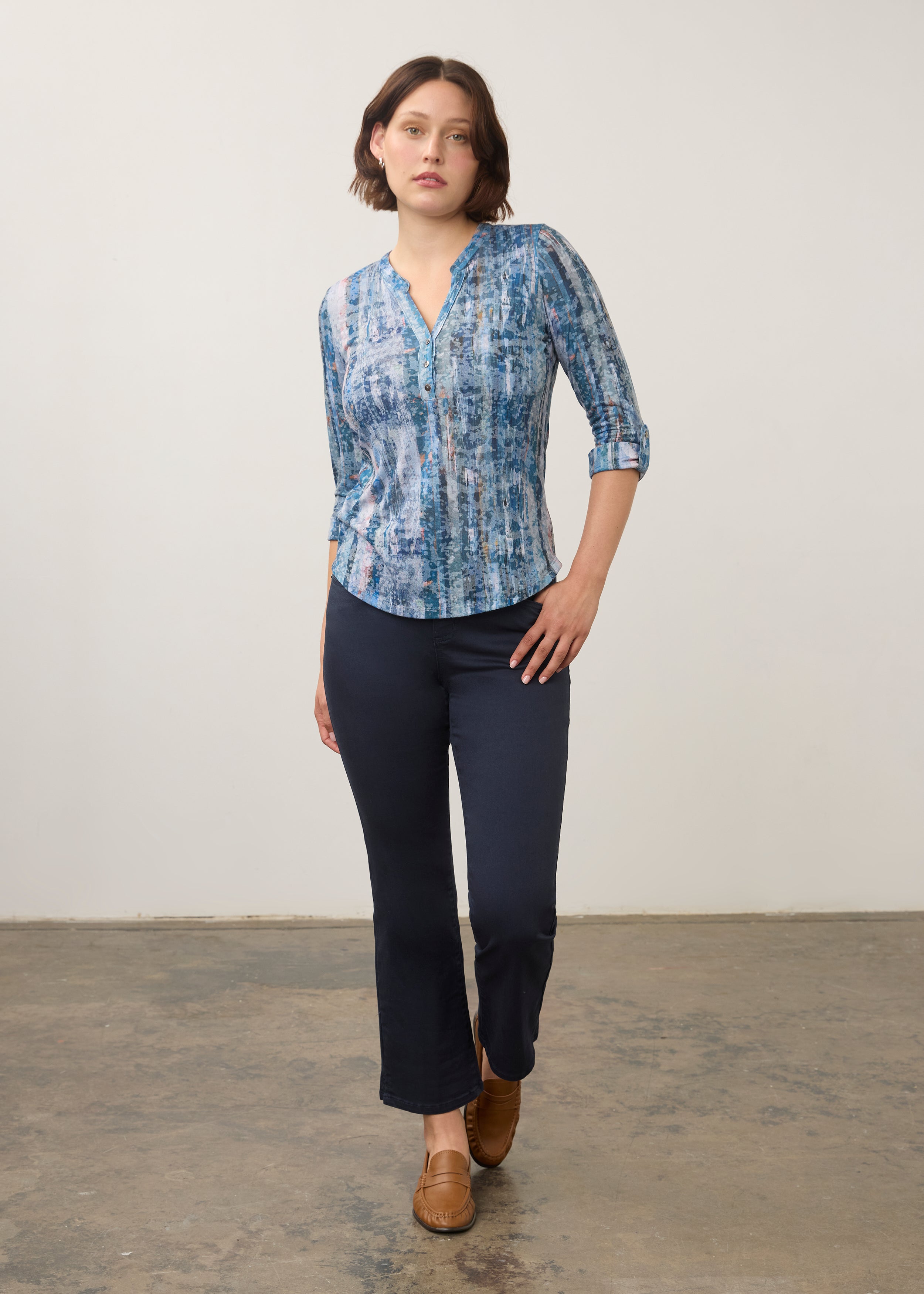 Full-body view of blue patterned 3/4 sleeve top paired with navy pants by French Dressing Jeans (FDJ)