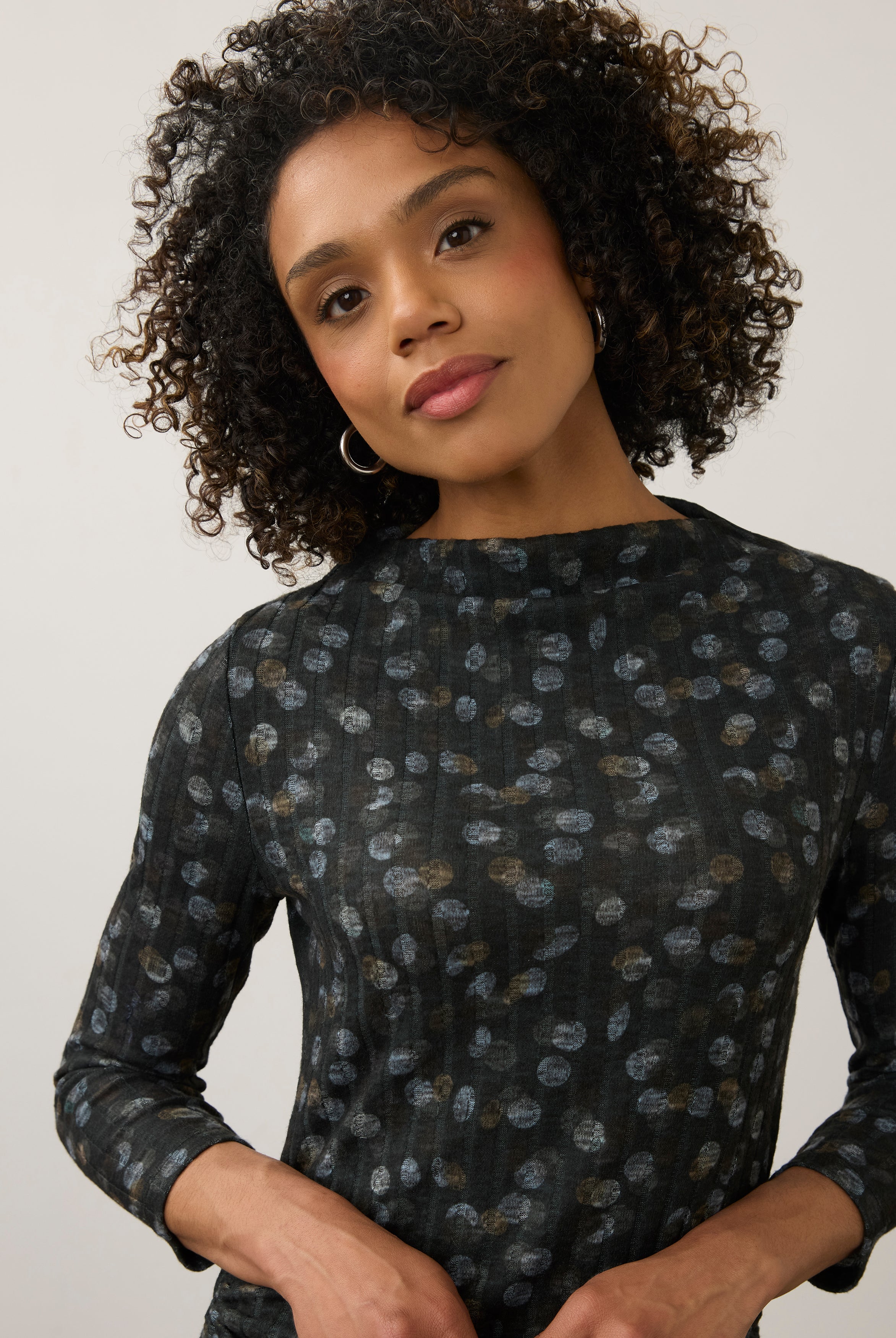 Close-up of black polka dot top, showcasing the detailed pattern and neckline by French Dressing Jeans (FDJ)
