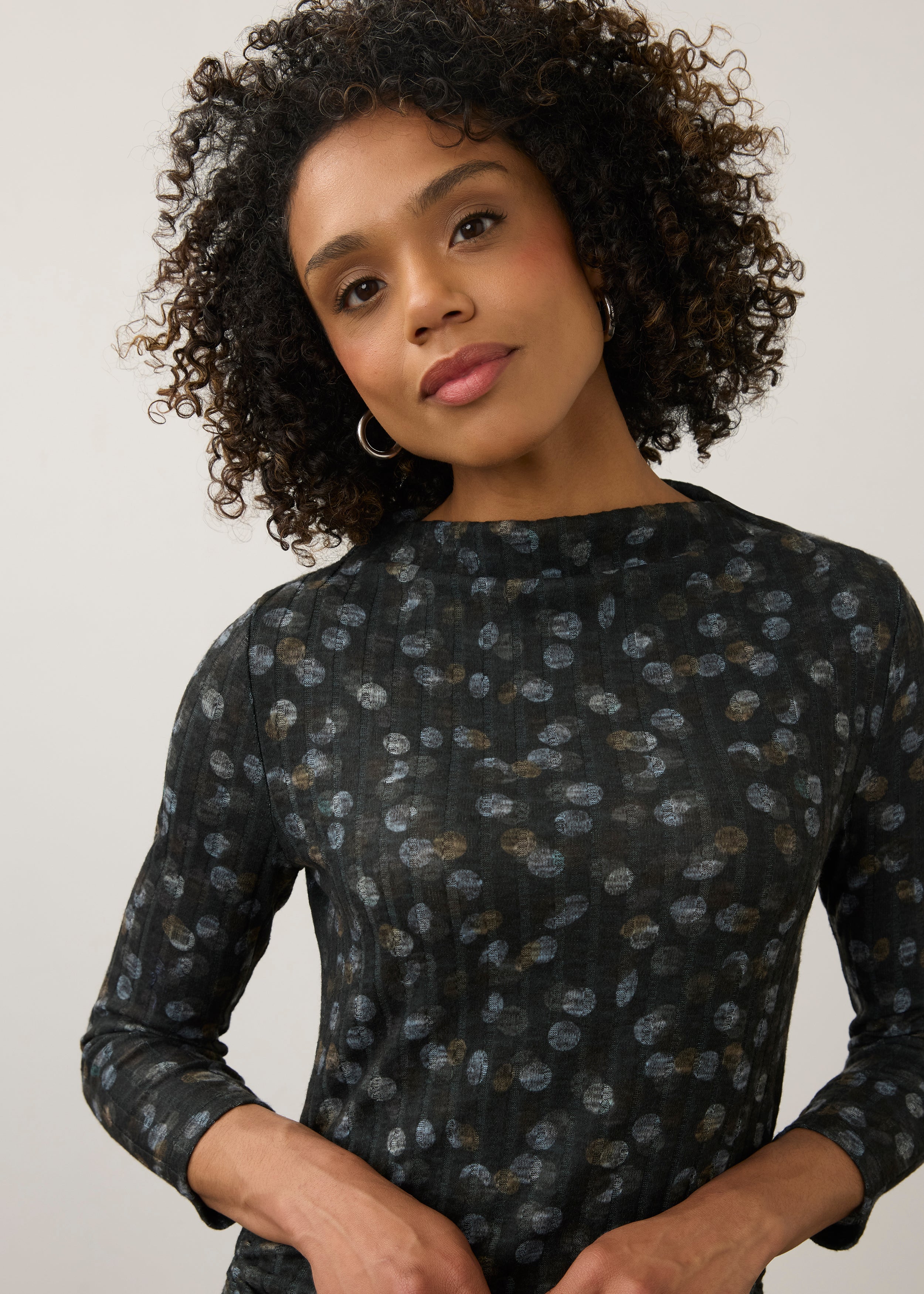 Close-up of black polka dot top, showcasing the detailed pattern and neckline by French Dressing Jeans (FDJ)