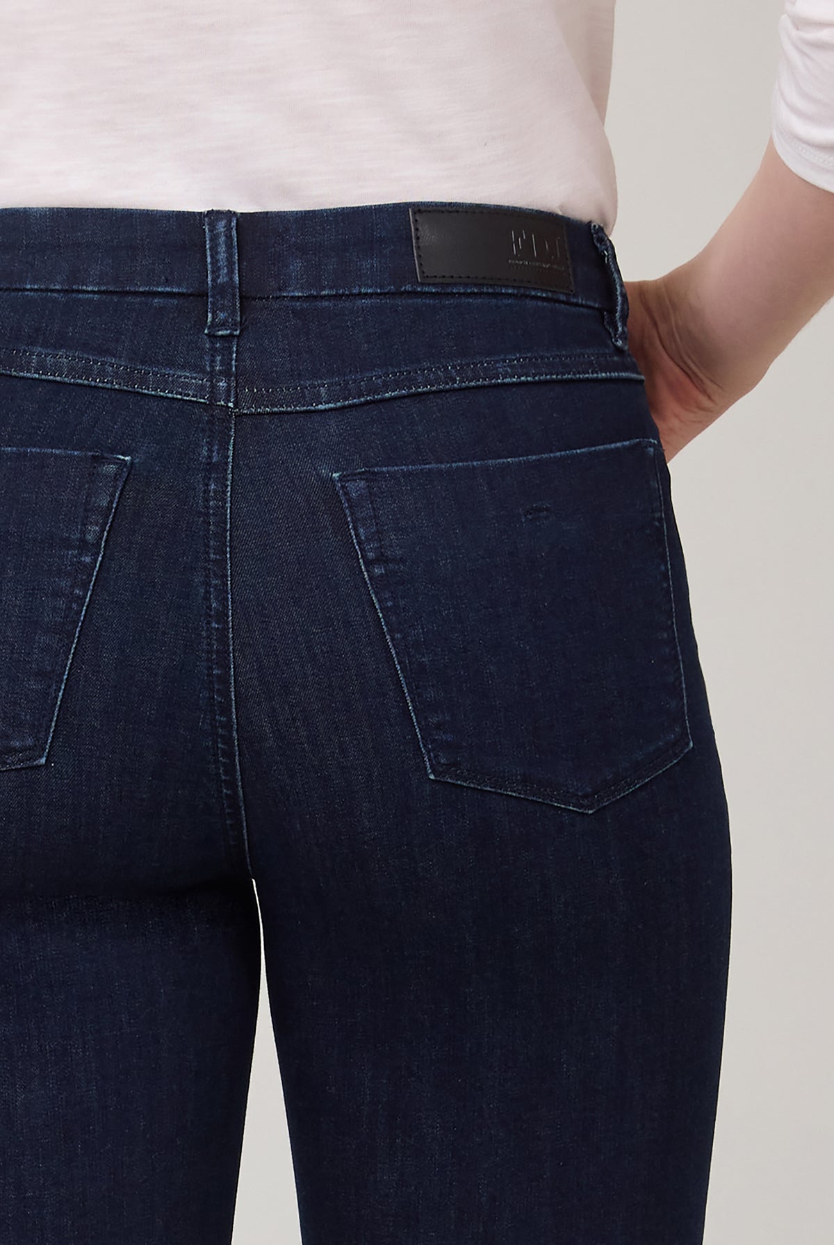 Detail of back pocket and stitching on flared Delight jeans by French Dressing Jeans (FDJ)