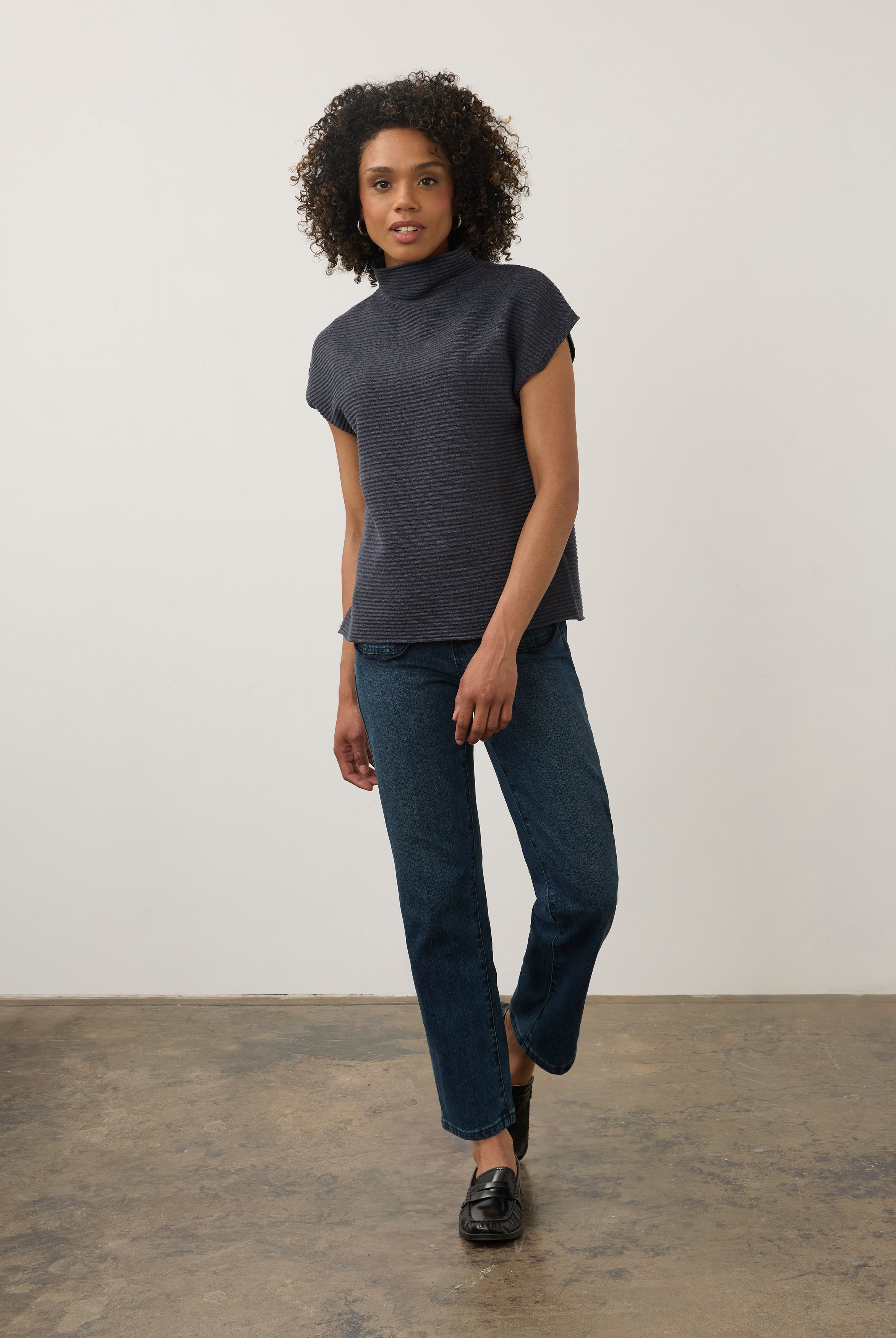 Model in navy ribbed top paired with jeans, full outfit view by French Dressing Jeans (FDJ)