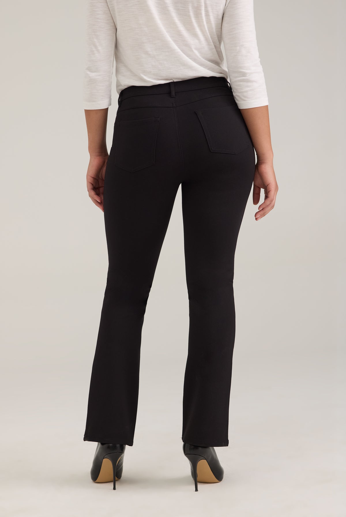 Back view of black pants with patch pockets and tailored fit by French Dressing Jeans (FDJ)
