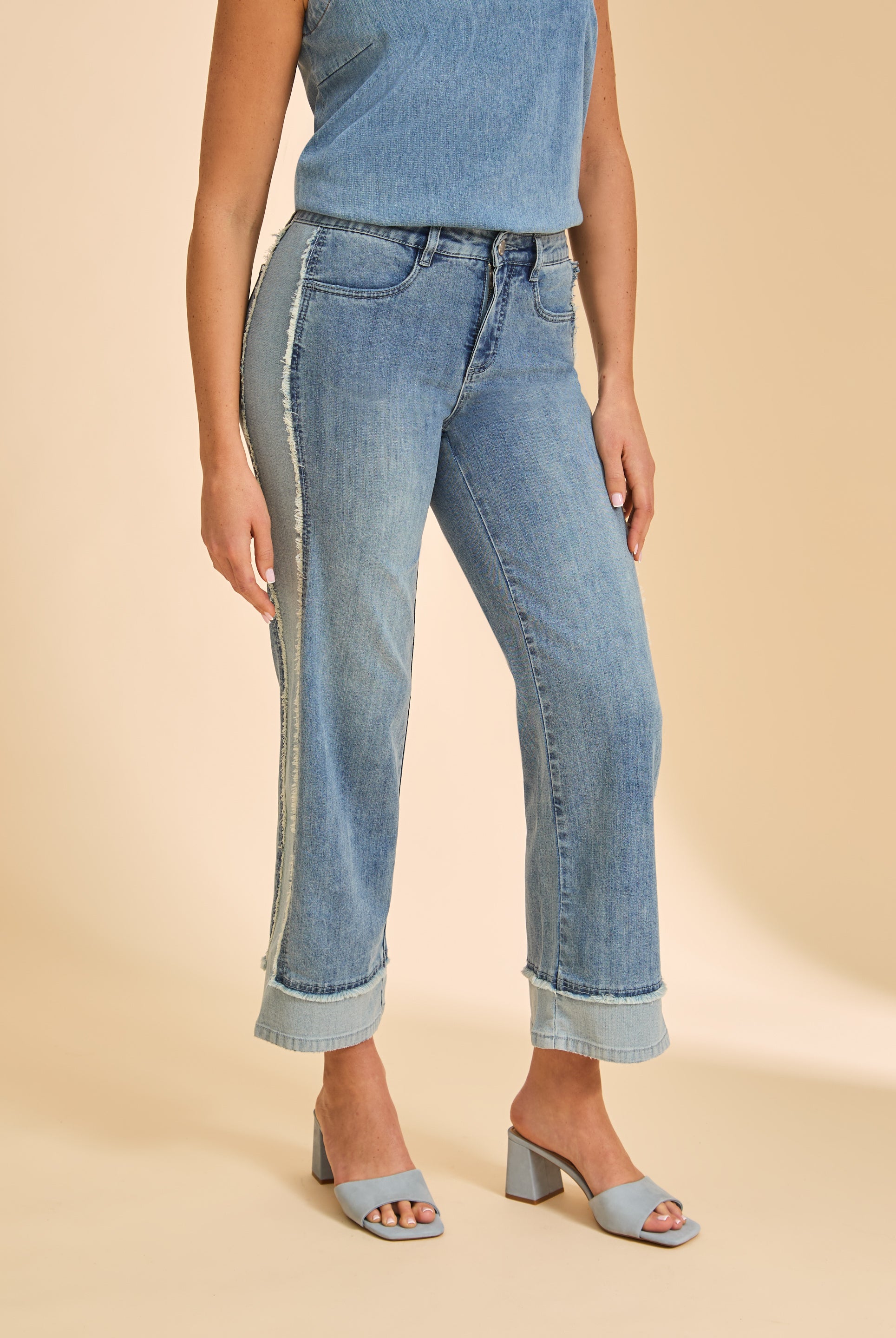 Close-up of light wash Olivia wide ankle denim highlighting front welt pockets and frayed side seams by French Dressing Jeans (FDJ)