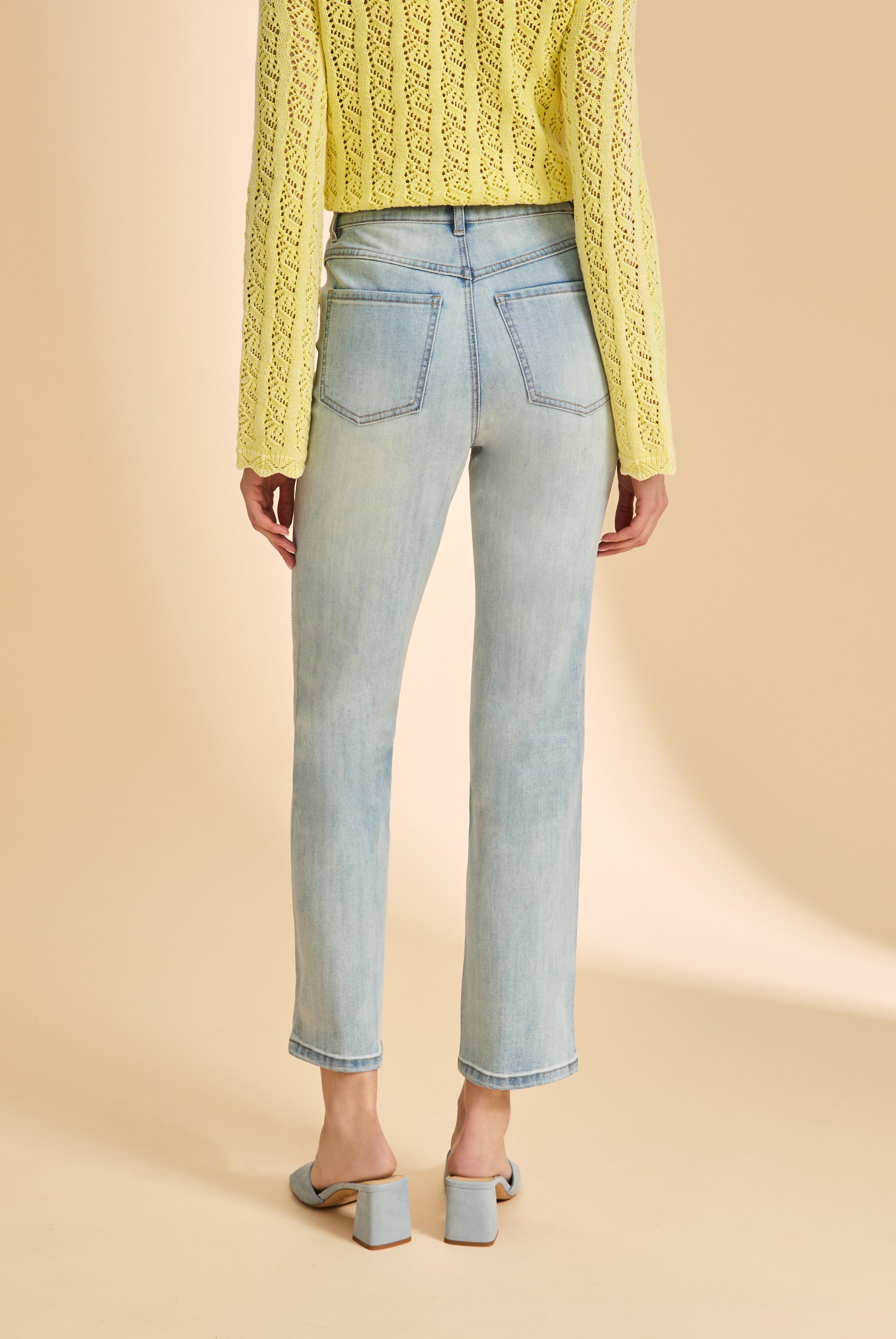 Back view of embellished light wash jeans with patch pockets by French Dressing Jeans (FDJ)