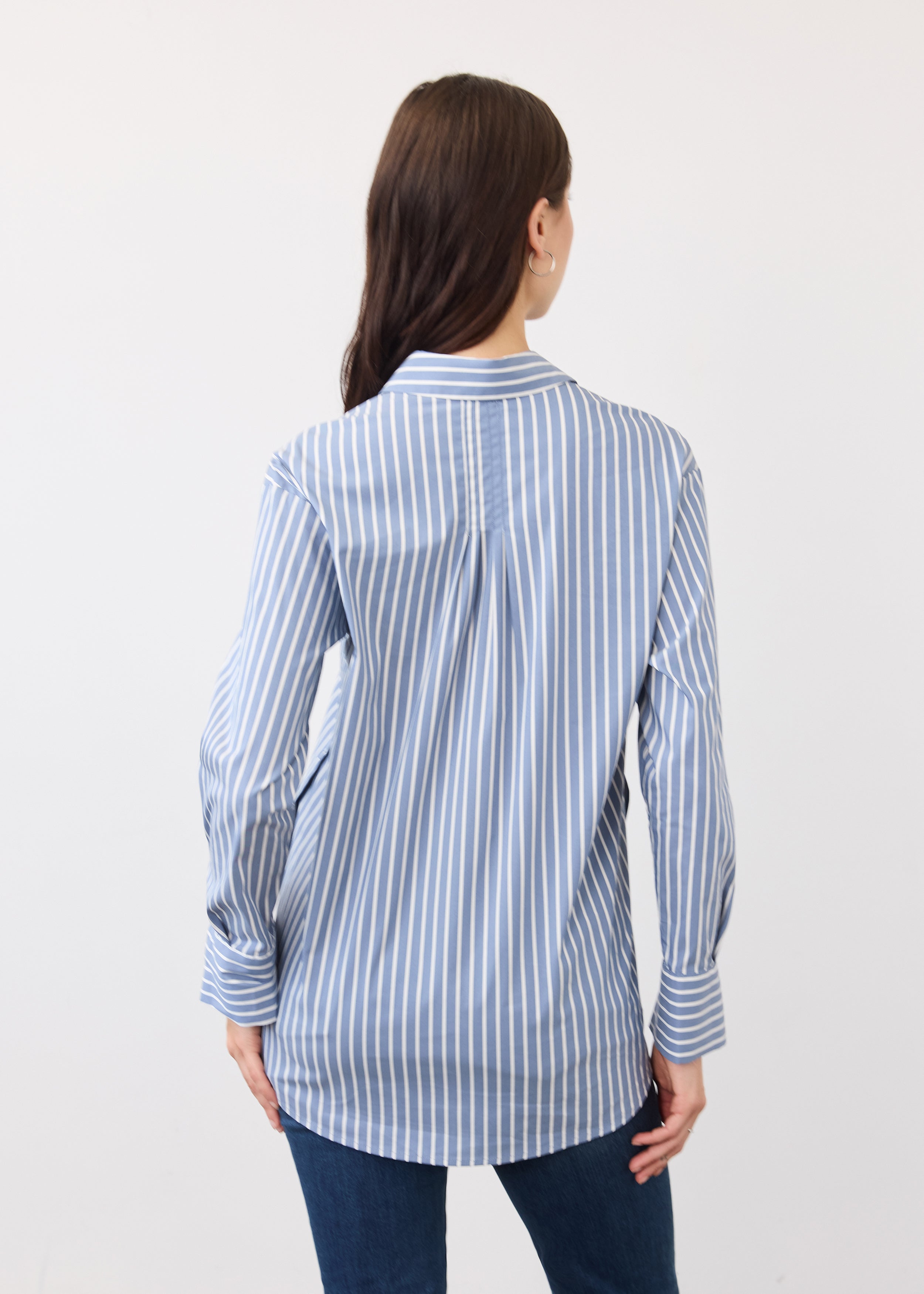 Back view of blue striped shirt featuring vertical stripes and relaxed fit by French Dressing Jeans (FDJ)