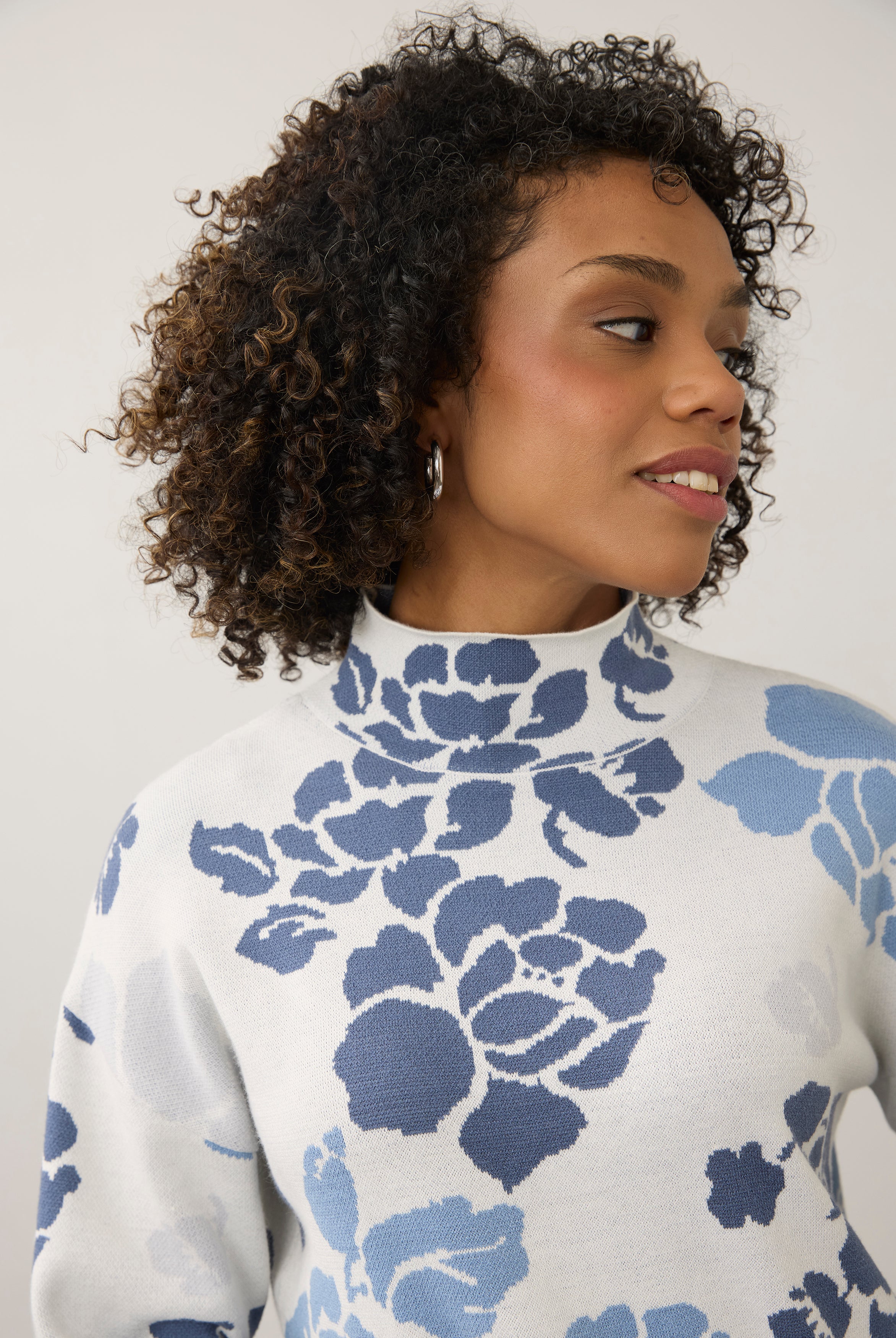 Close-up of blue floral sweater with high collar detail by French Dressing Jeans (FDJ)