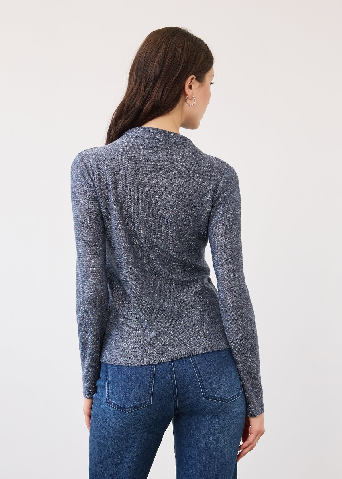 Back view of blue shimmer top showing seamless look and long sleeves by French Dressing Jeans (FDJ)