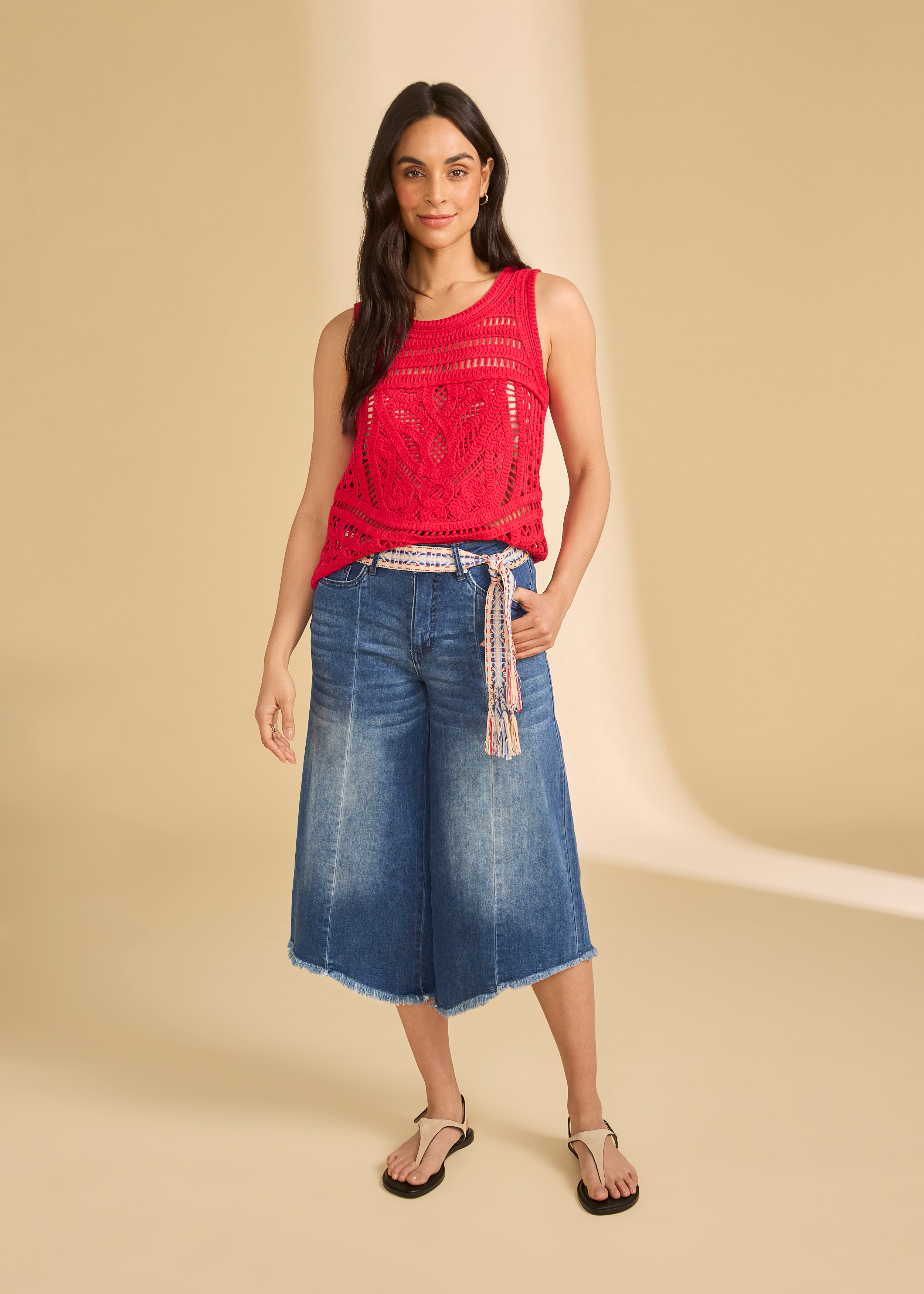Full-body view of denim culottes with red crochet top and braided belt by French Dressing Jeans (FDJ)