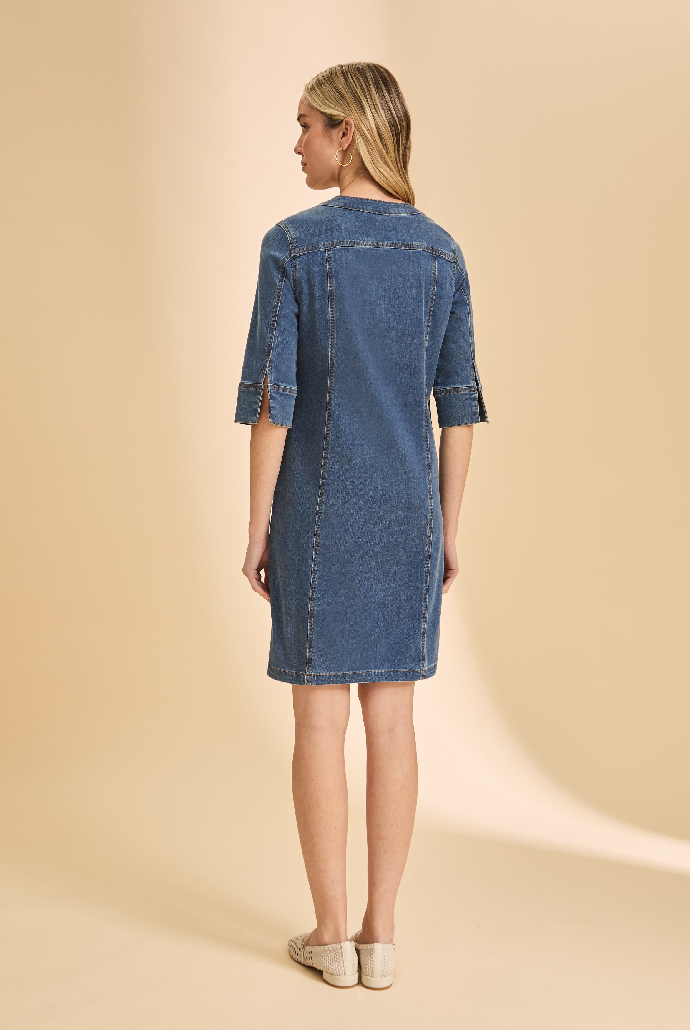 Back view of denim dress showing simple design and mid-length cut by French Dressing Jeans (FDJ)