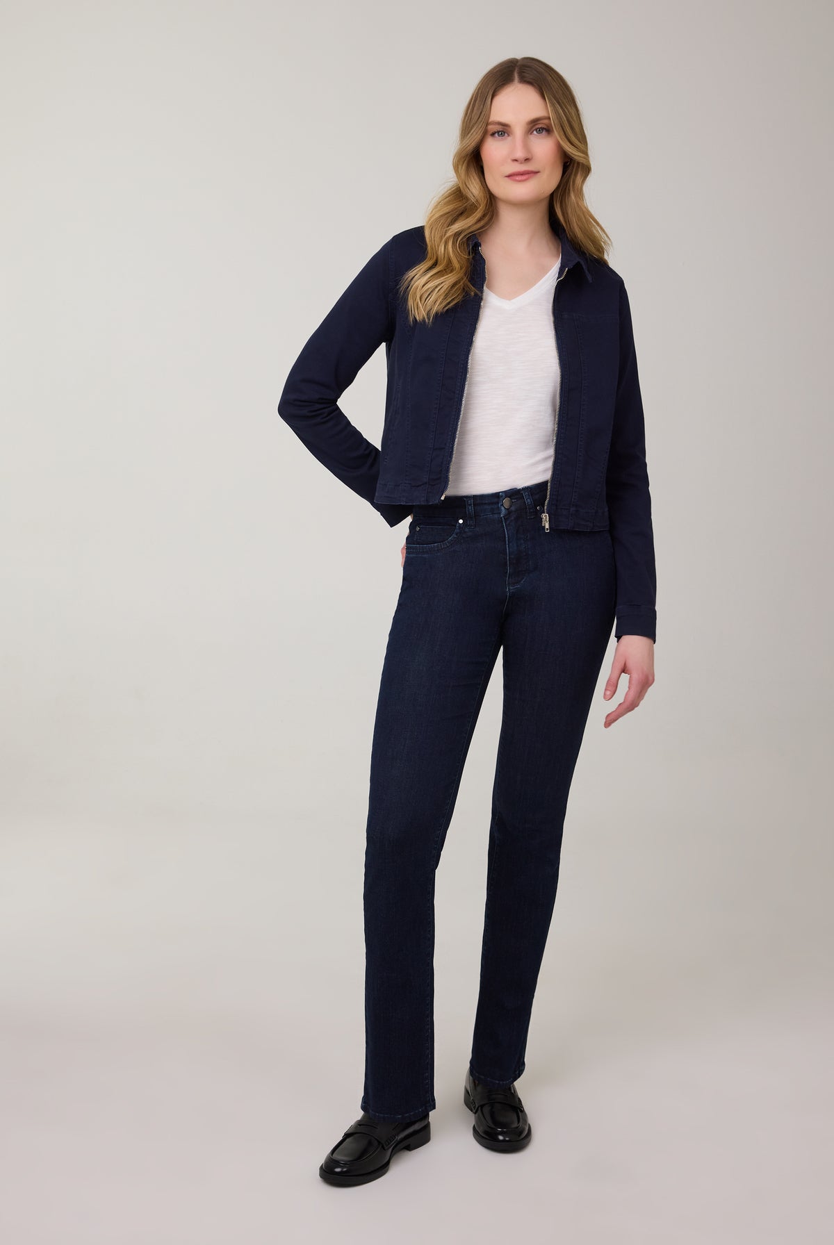 Model in flared leg jeans in Delight color with denim top by French Dressing Jeans (FDJ)