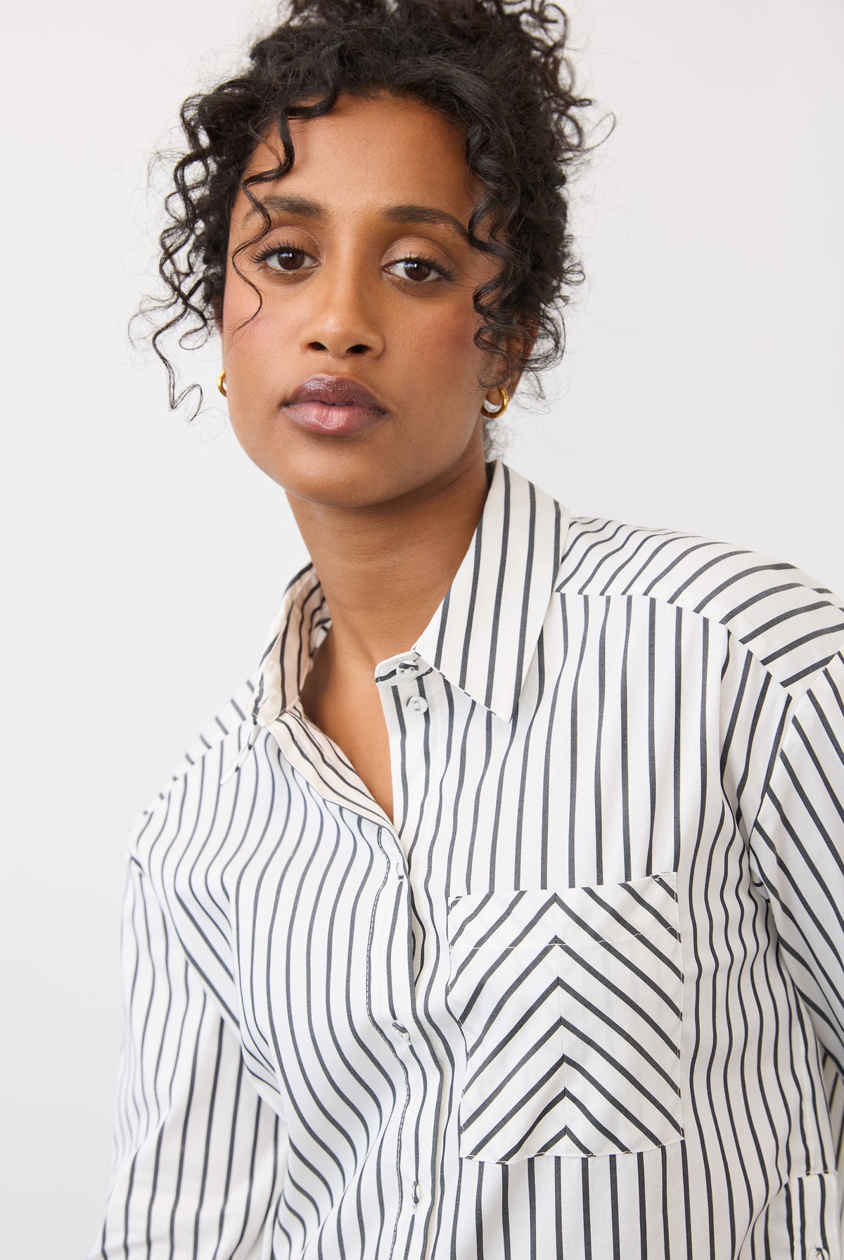 Close-up of black striped shirt highlighting collar and pocket details by French Dressing Jeans (FDJ)