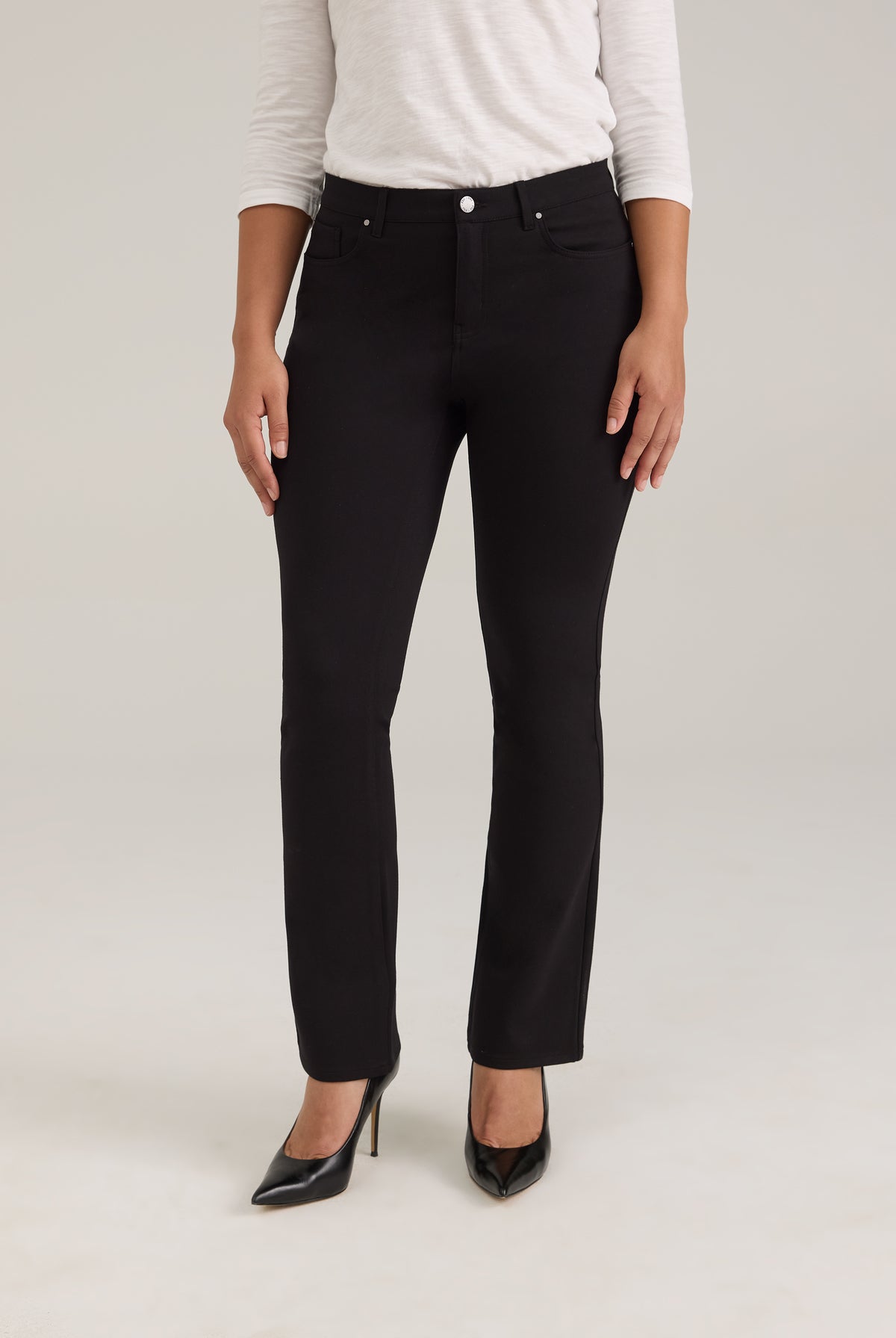 Front view of black pants with silver button and sleek design by French Dressing Jeans (FDJ)