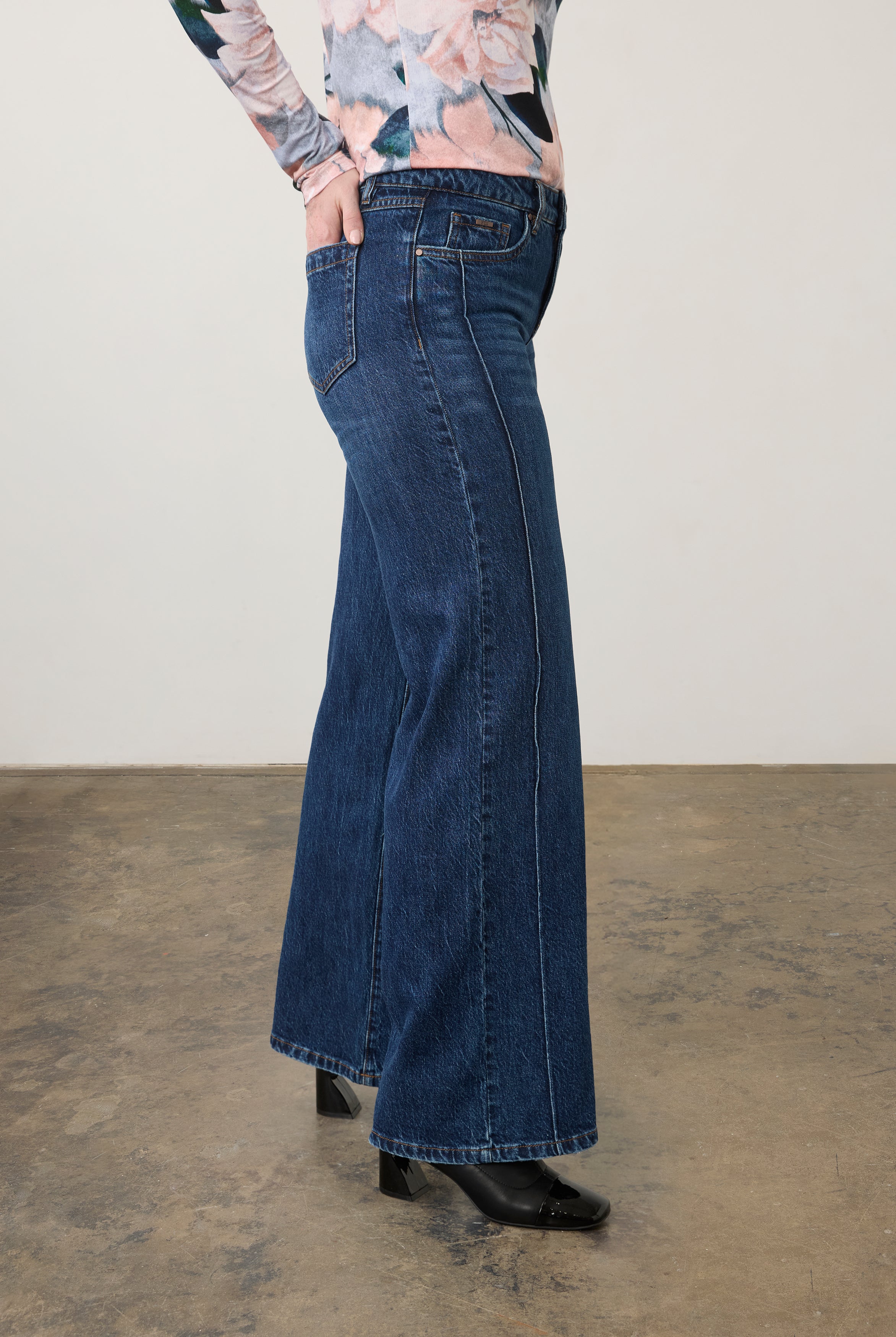 Side view of dark wash jeans highlighting straight leg fit with floral top by French Dressing Jeans (FDJ) par French Dressing Jeans (FDJ)