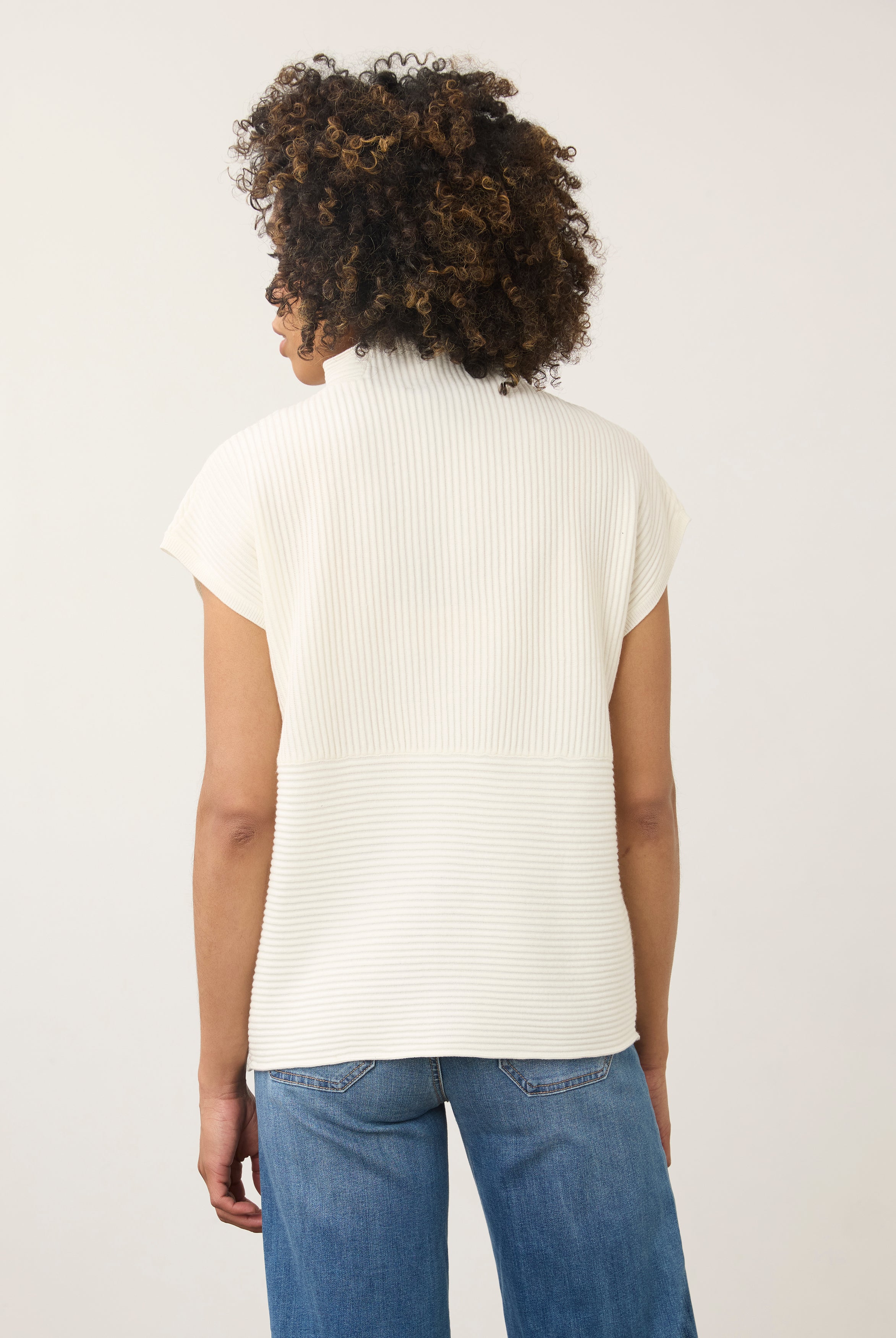 Back view of white ribbed top with high collar and seamless finish by French Dressing Jeans (FDJ)