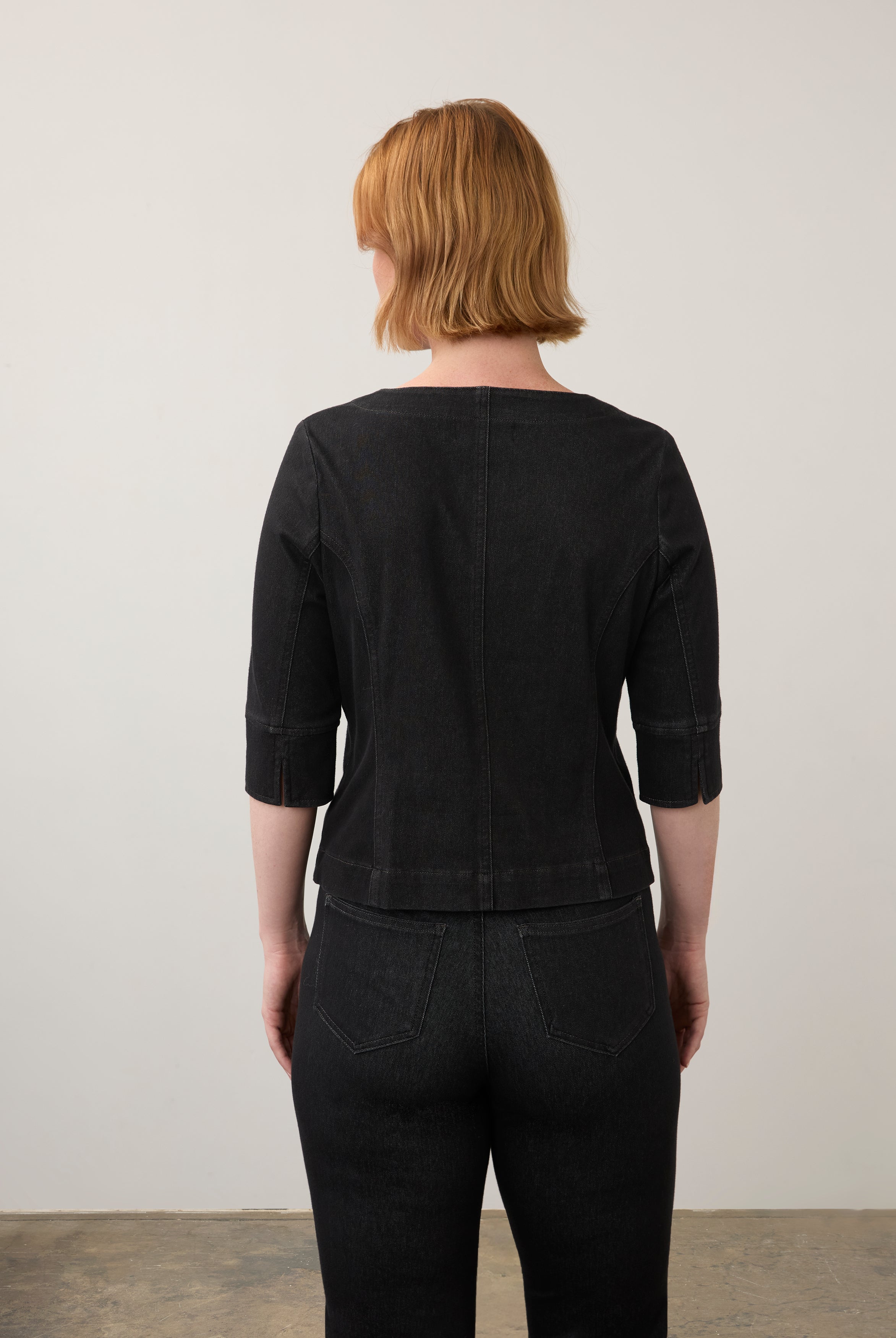 Back view of black button-up top with elbow-length sleeves and seam detailing by French Dressing Jeans (FDJ)