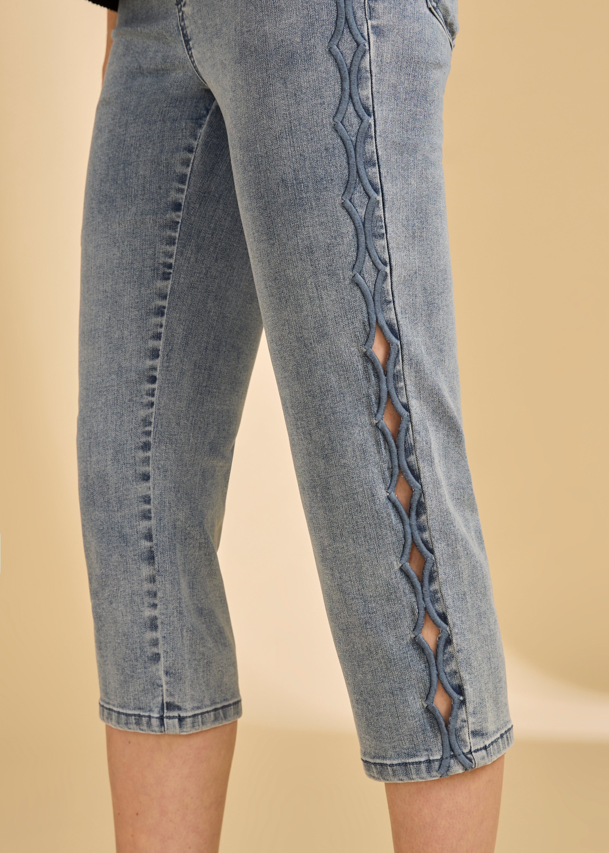 Detail shot of side button design on light medium capri denim by French Dressing Jeans (FDJ)