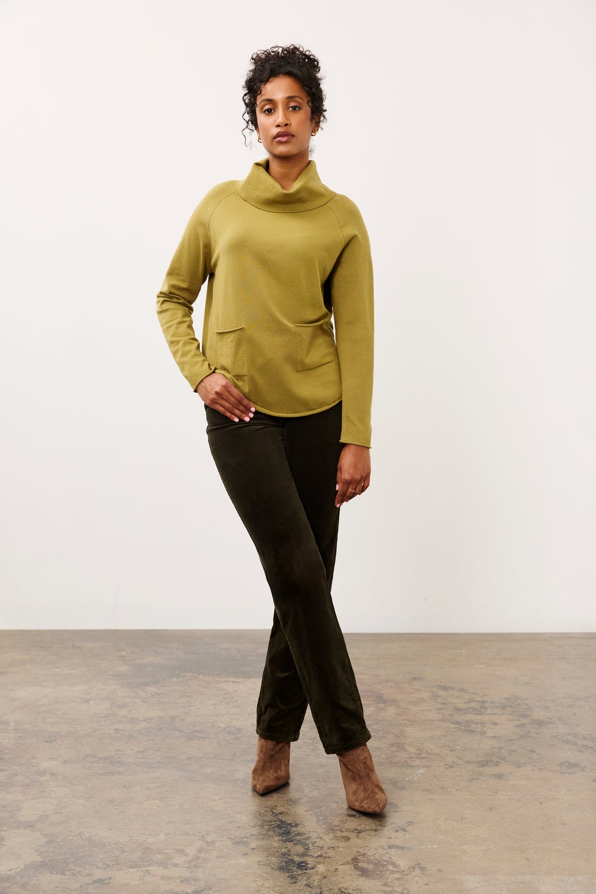 Full outfit view of olive sweater styled with dark pants by French Dressing Jeans (FDJ)