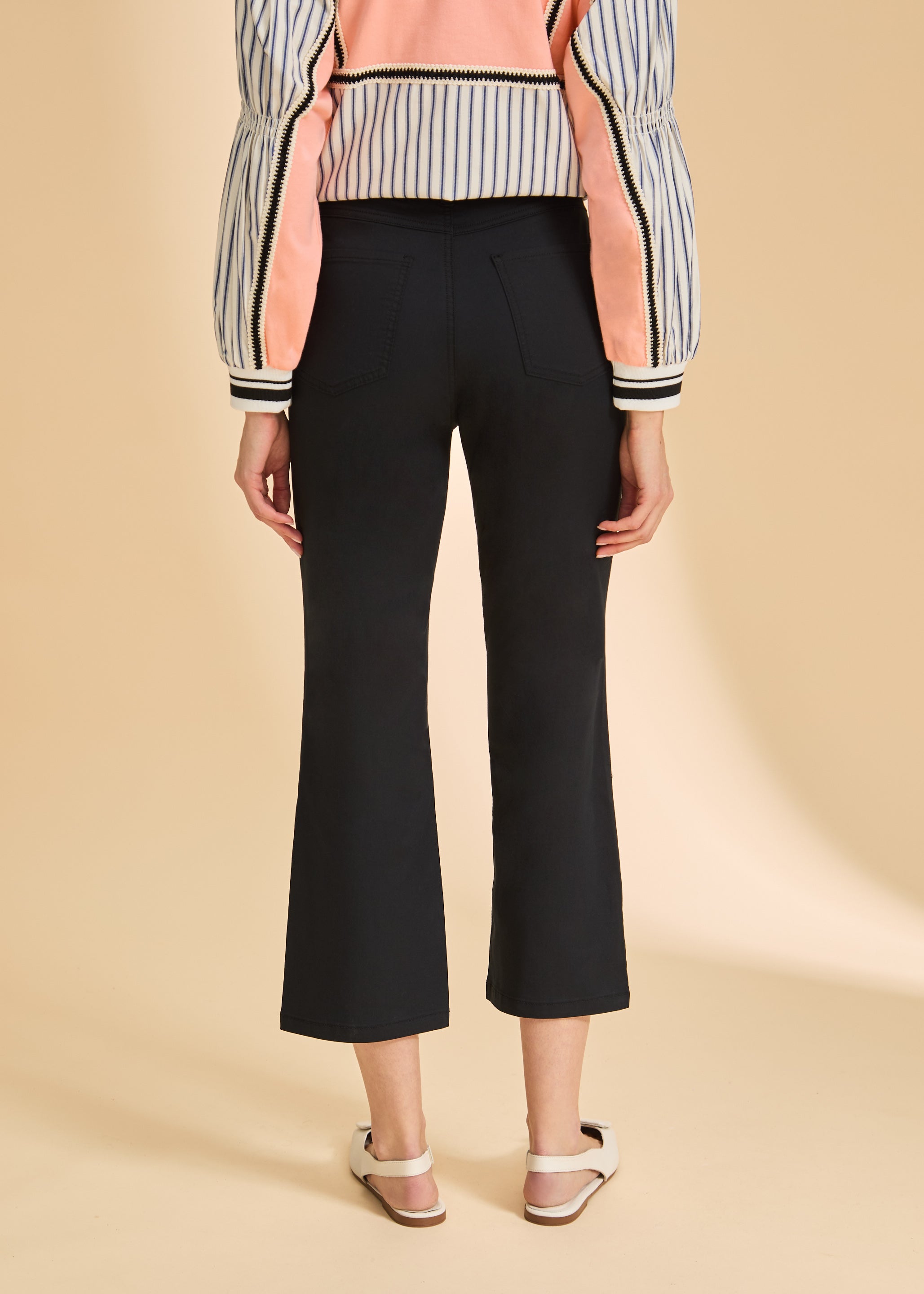 Back view of black crop pants showcasing patch pockets and tailored look by French Dressing Jeans (FDJ)