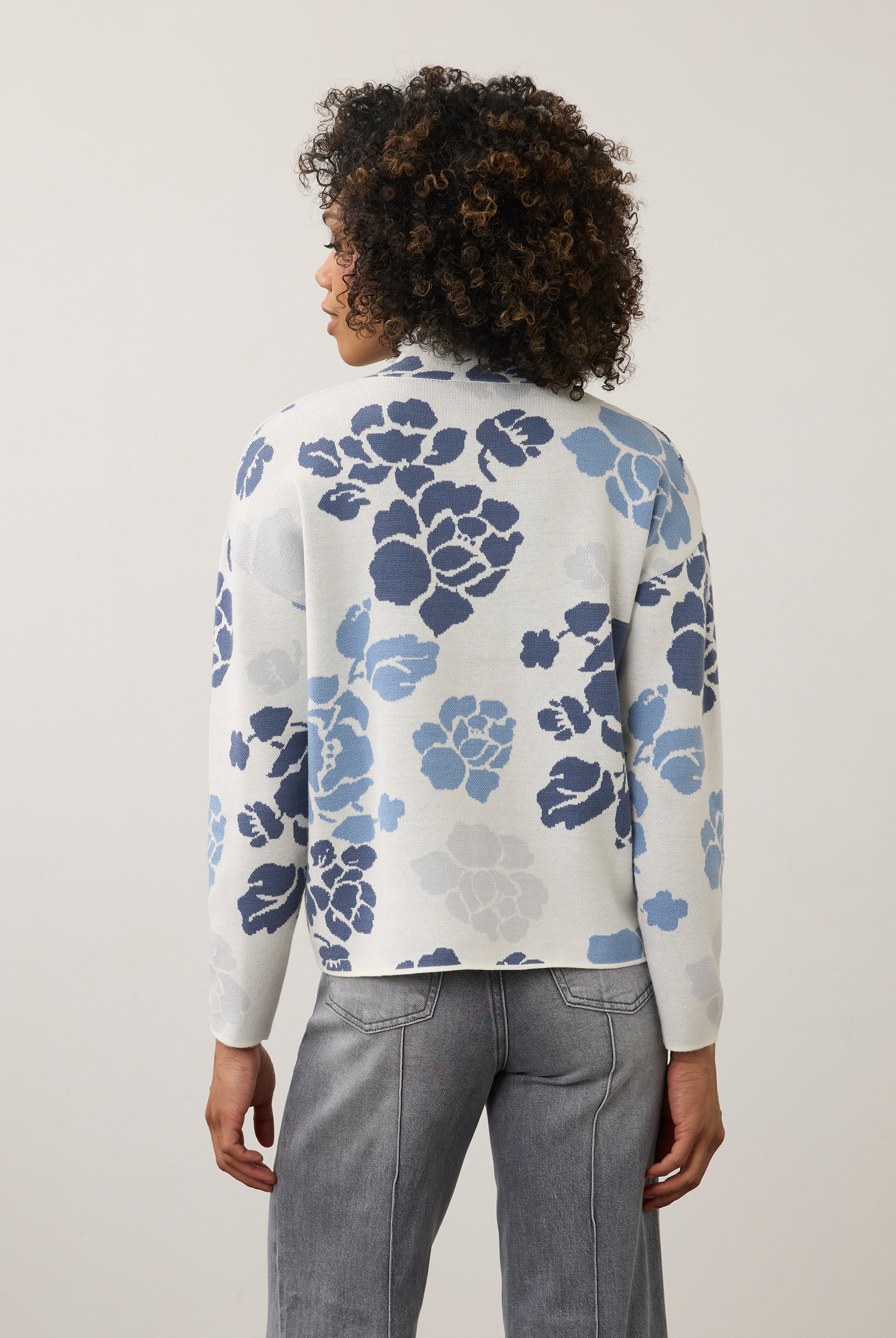 Back view of blue floral sweater showing seamless design by French Dressing Jeans (FDJ)