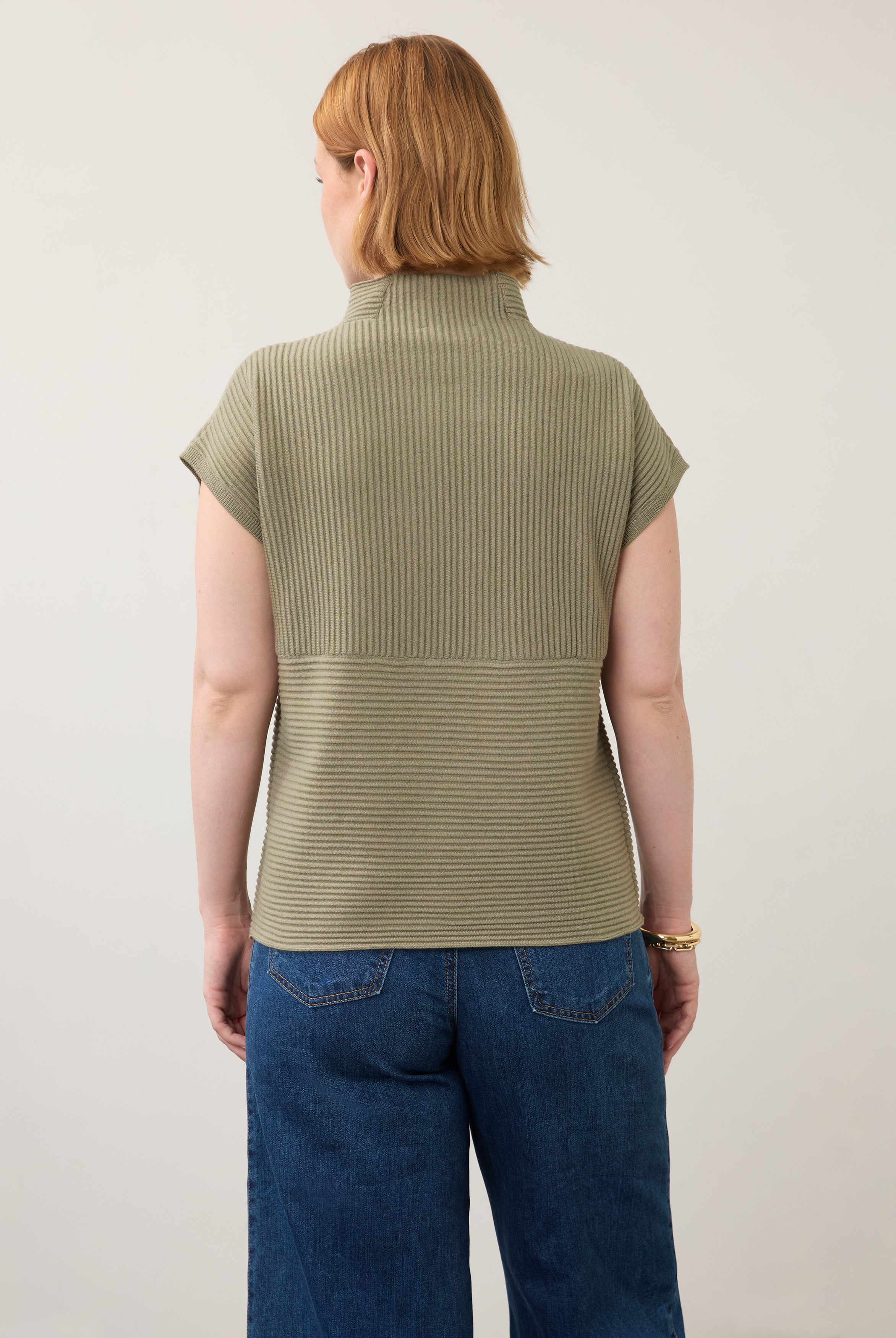 Back view of olive green ribbed top with high collar and seamless finish by French Dressing Jeans (FDJ)