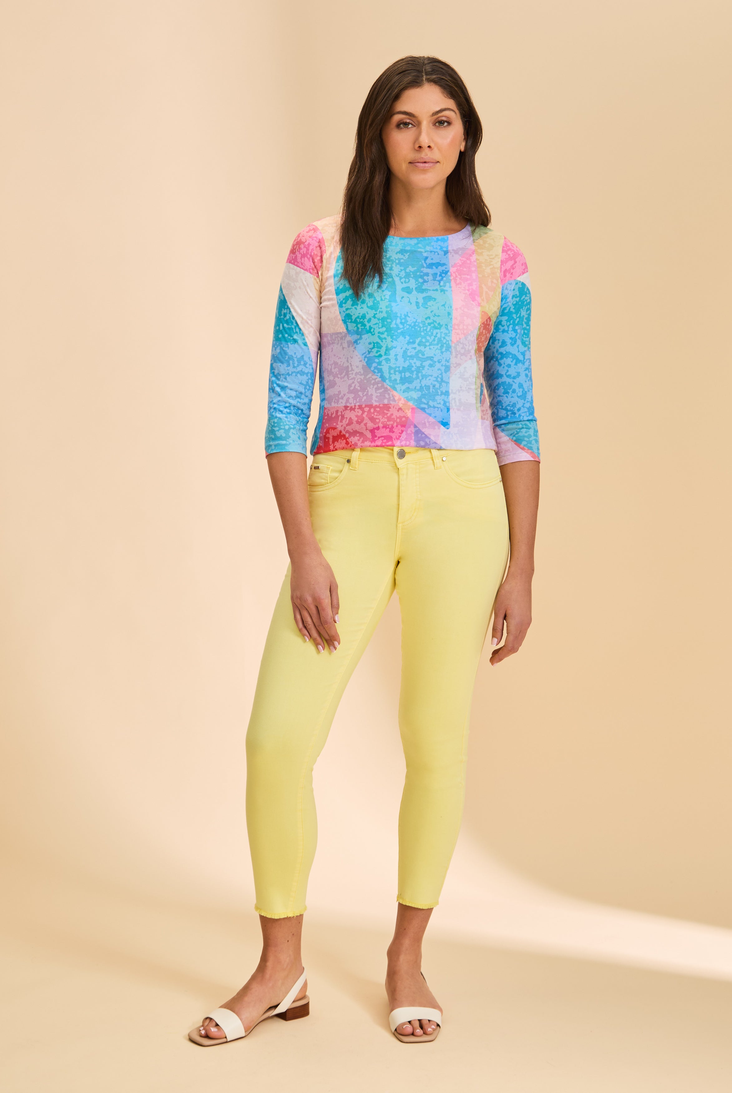 Full outfit view with colorful geometric top and yellow pants, highlighting bright pattern by French Dressing Jeans (FDJ)