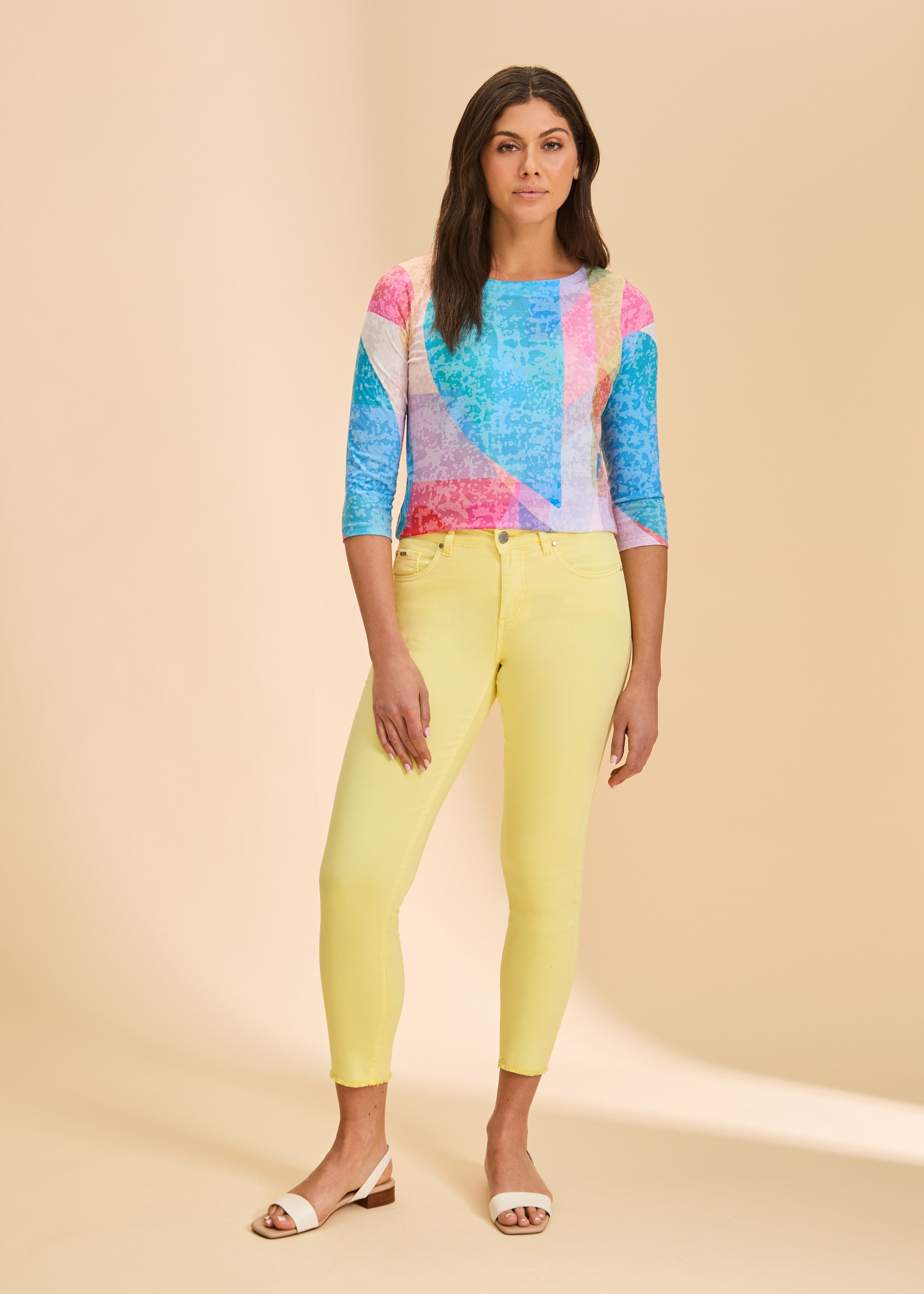 Full outfit view with colorful geometric top and yellow pants, highlighting bright pattern by French Dressing Jeans (FDJ)