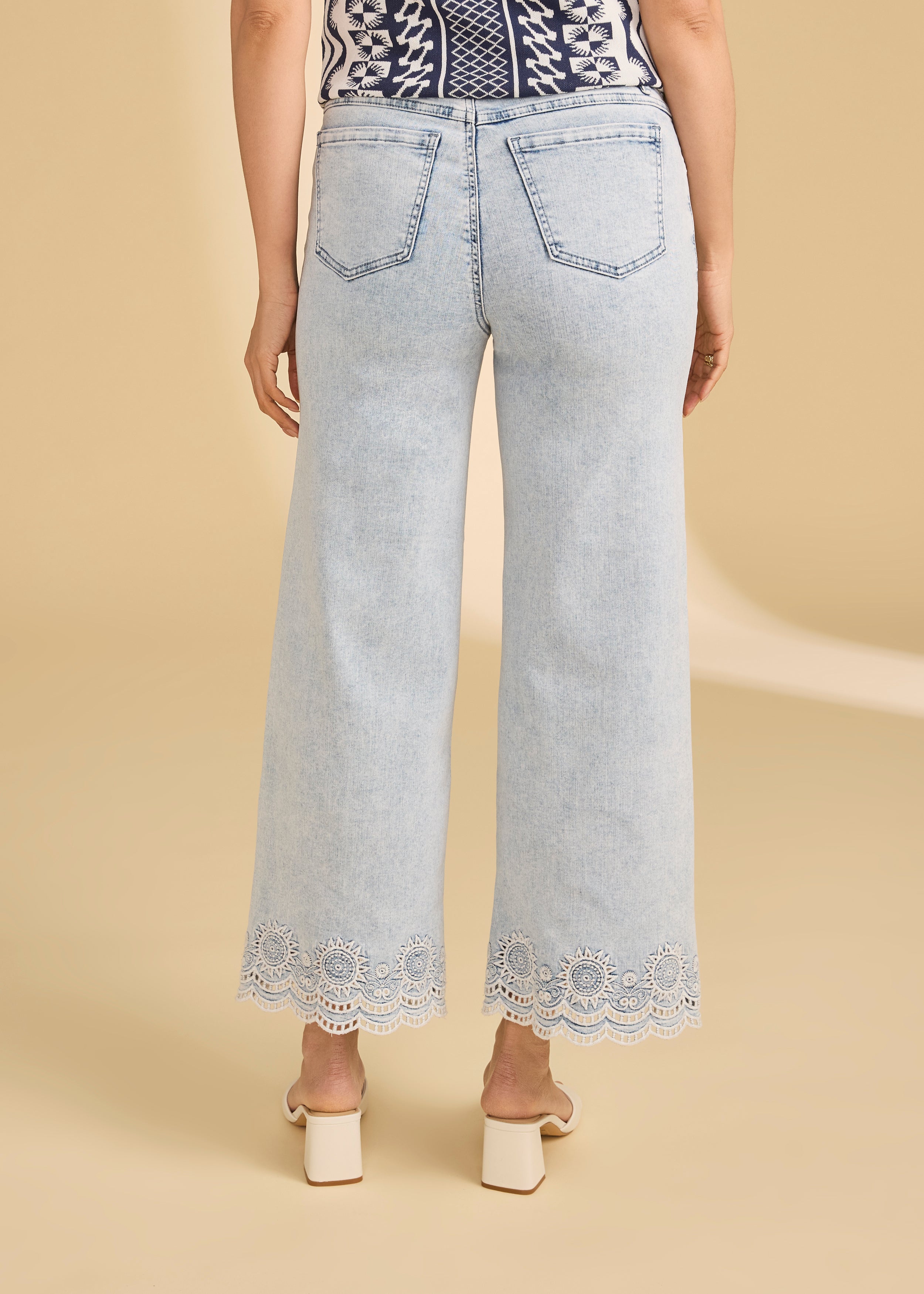 Back view of light medium pull-on wide ankle denim featuring patch pockets and lace hem by French Dressing Jeans (FDJ)