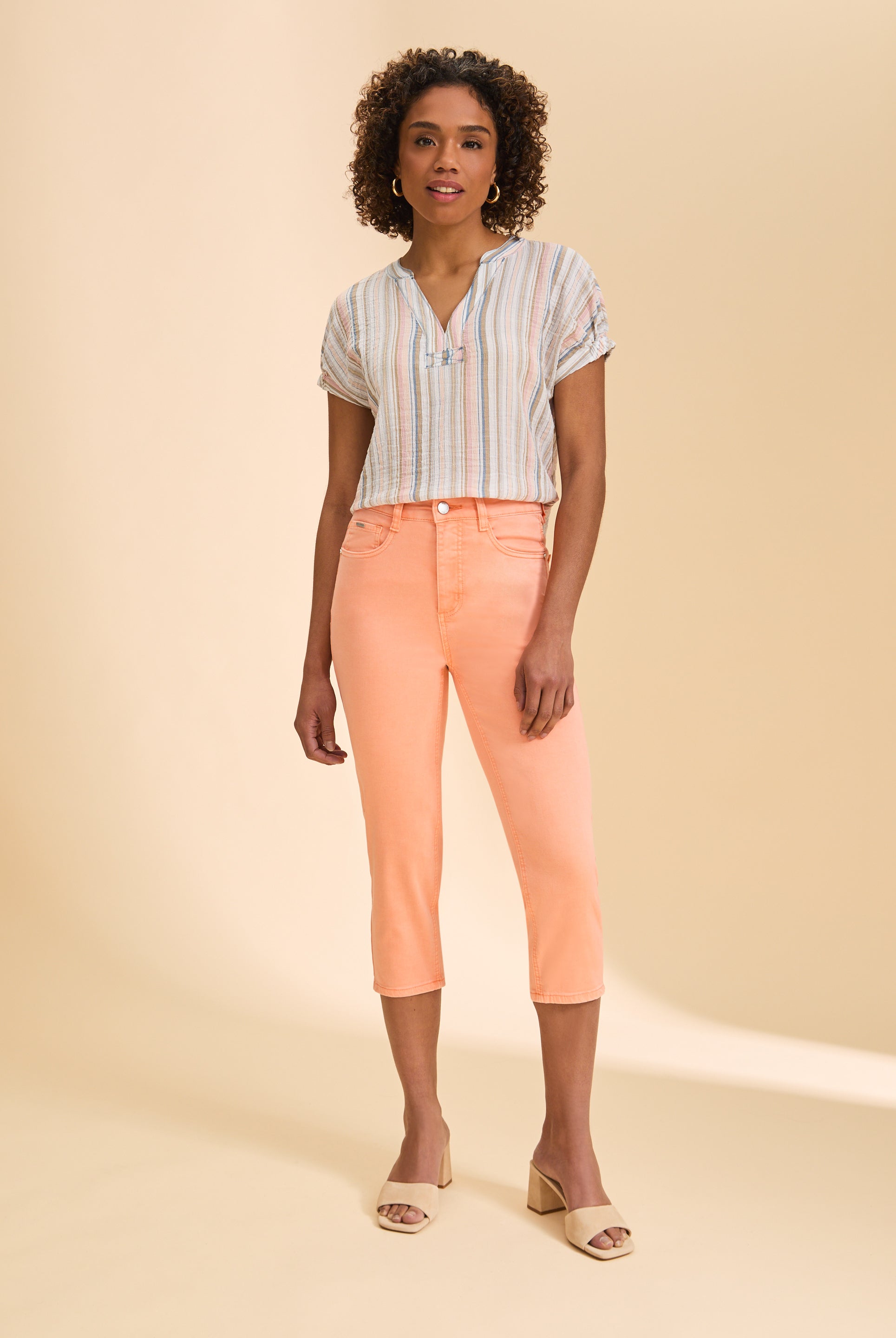Full view of multicolor striped blouse paired with peach pants and sandals by French Dressing Jeans (FDJ)