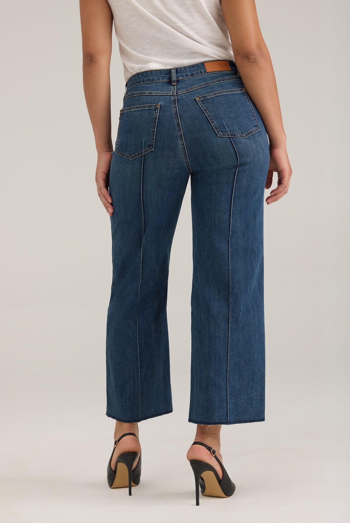 Back view of Olivia wide ankle jeans in dark wash featuring back pockets and mid-rise design by French Dressing Jeans (FDJ)
