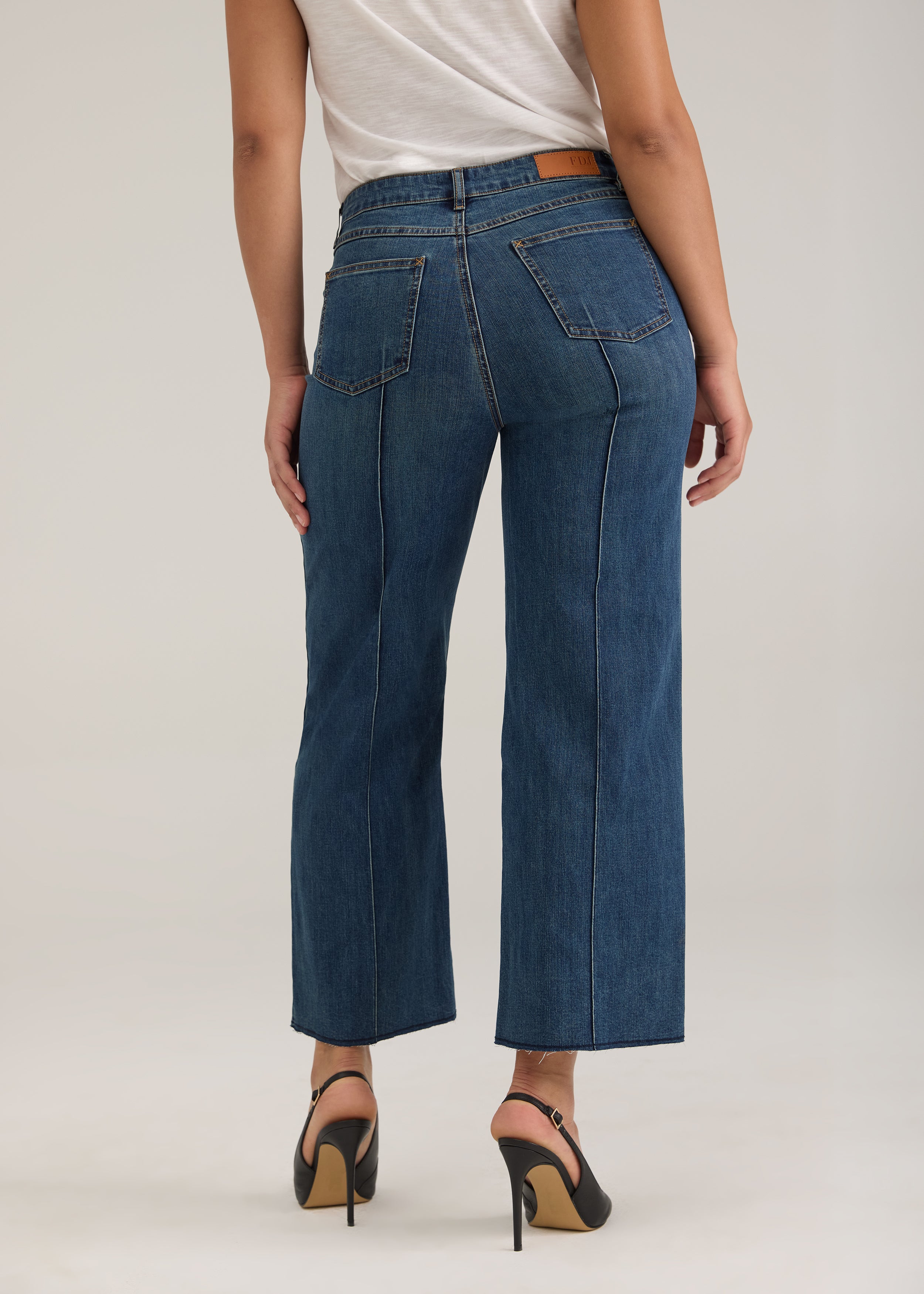 Back view of Olivia wide ankle jeans in dark wash featuring back pockets and mid-rise design by French Dressing Jeans (FDJ)