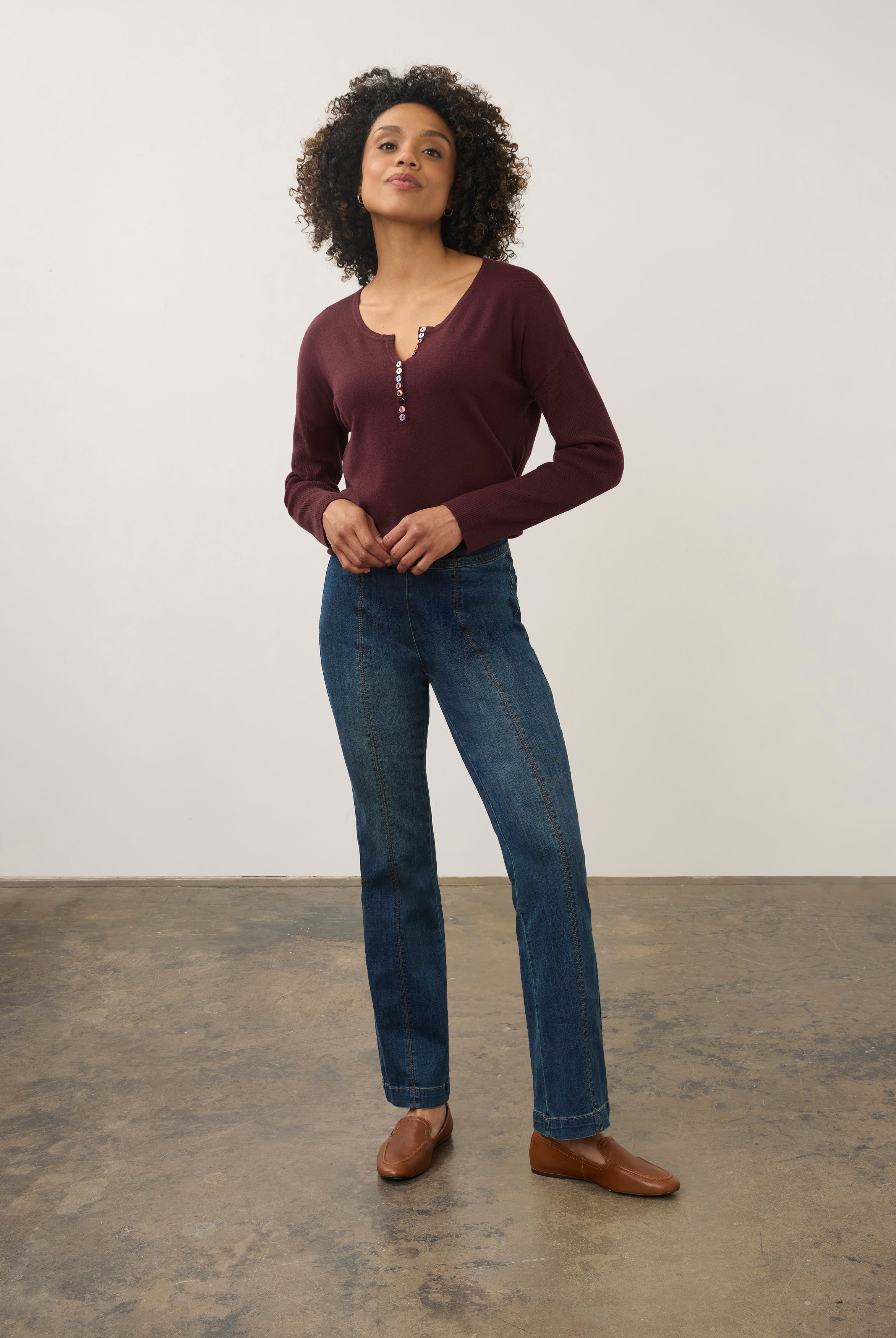 Model in medium blue jeans with maroon top, front view showing fitted waist by French Dressing Jeans (FDJ) par French Dressing Jeans (FDJ)