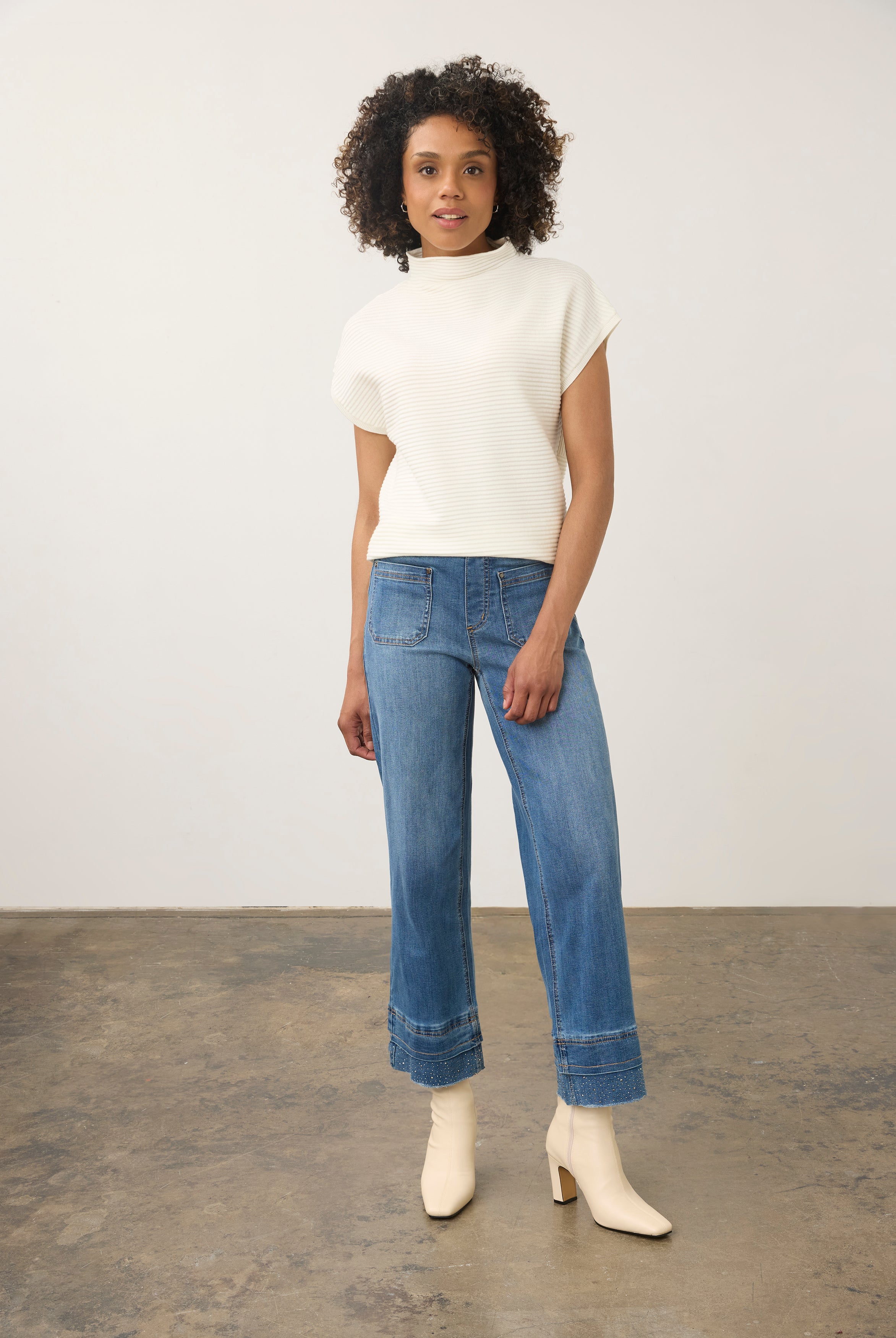 Model wearing medium blue wide ankle denim with mid-rise waist in full view by French Dressing Jeans (FDJ) par French Dressing Jeans (FDJ)