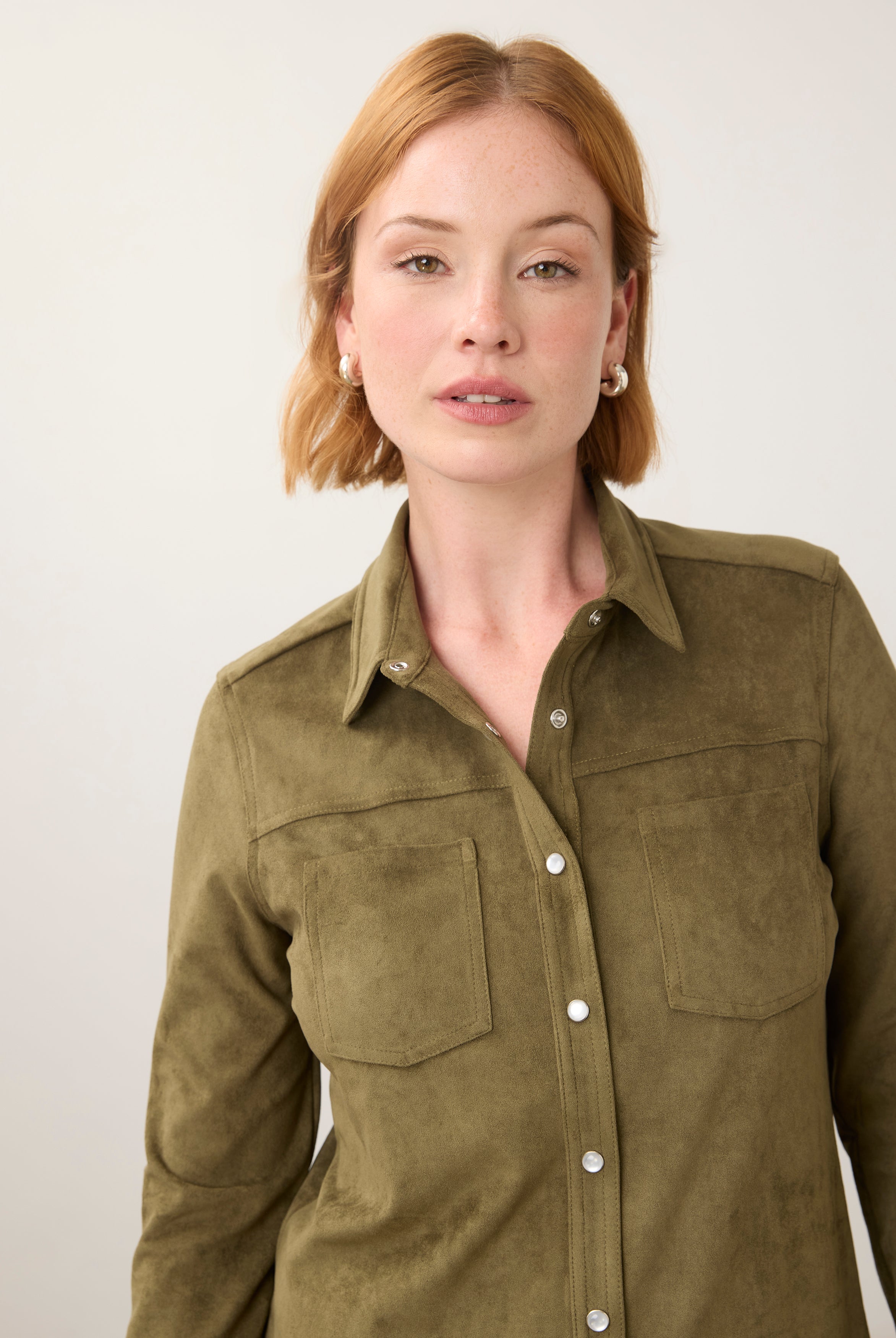Close-up of olive suede shirt focusing on button details by French Dressing Jeans (FDJ)