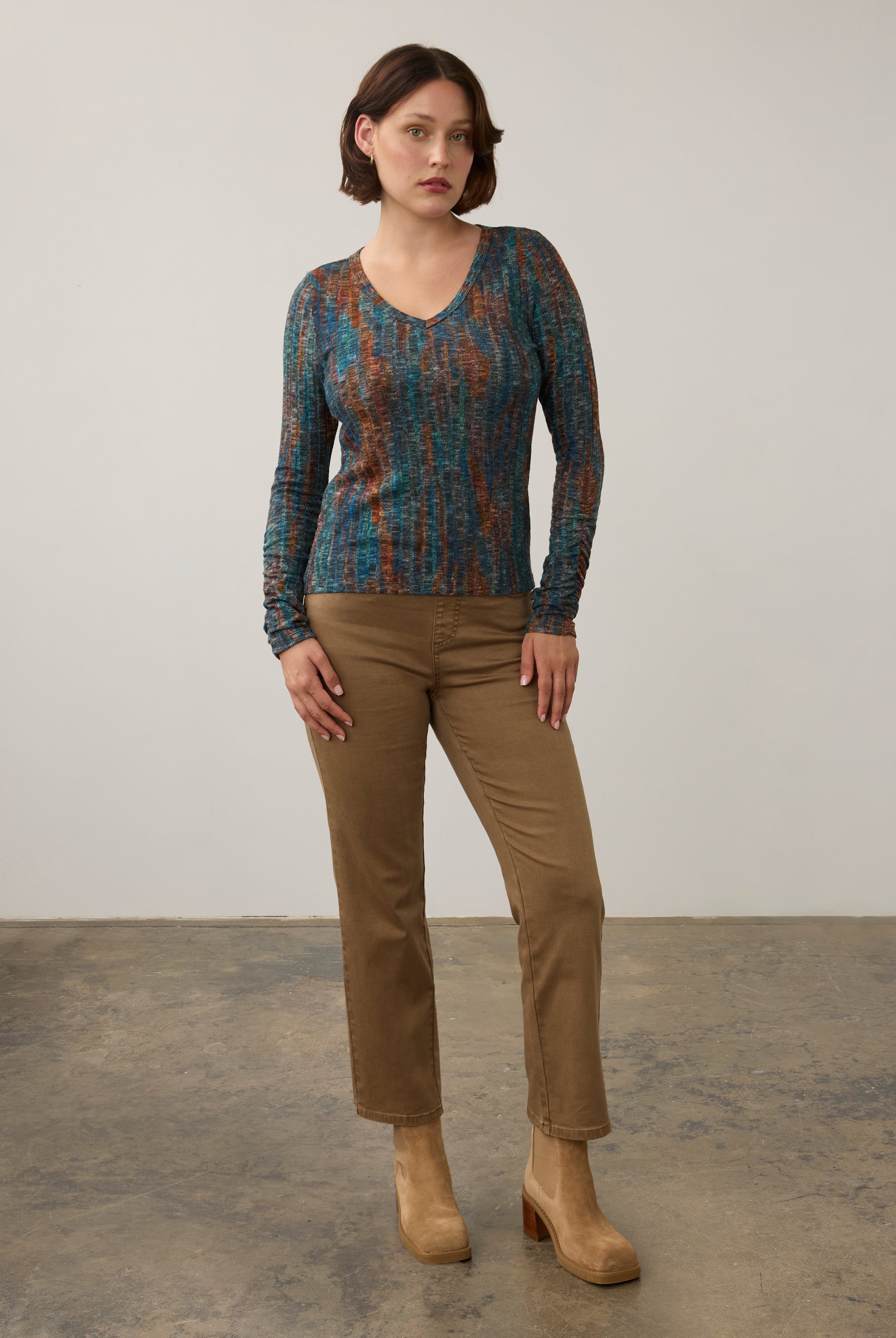 Full body view of striped V-neck top with beige pants, casual style by French Dressing Jeans (FDJ)