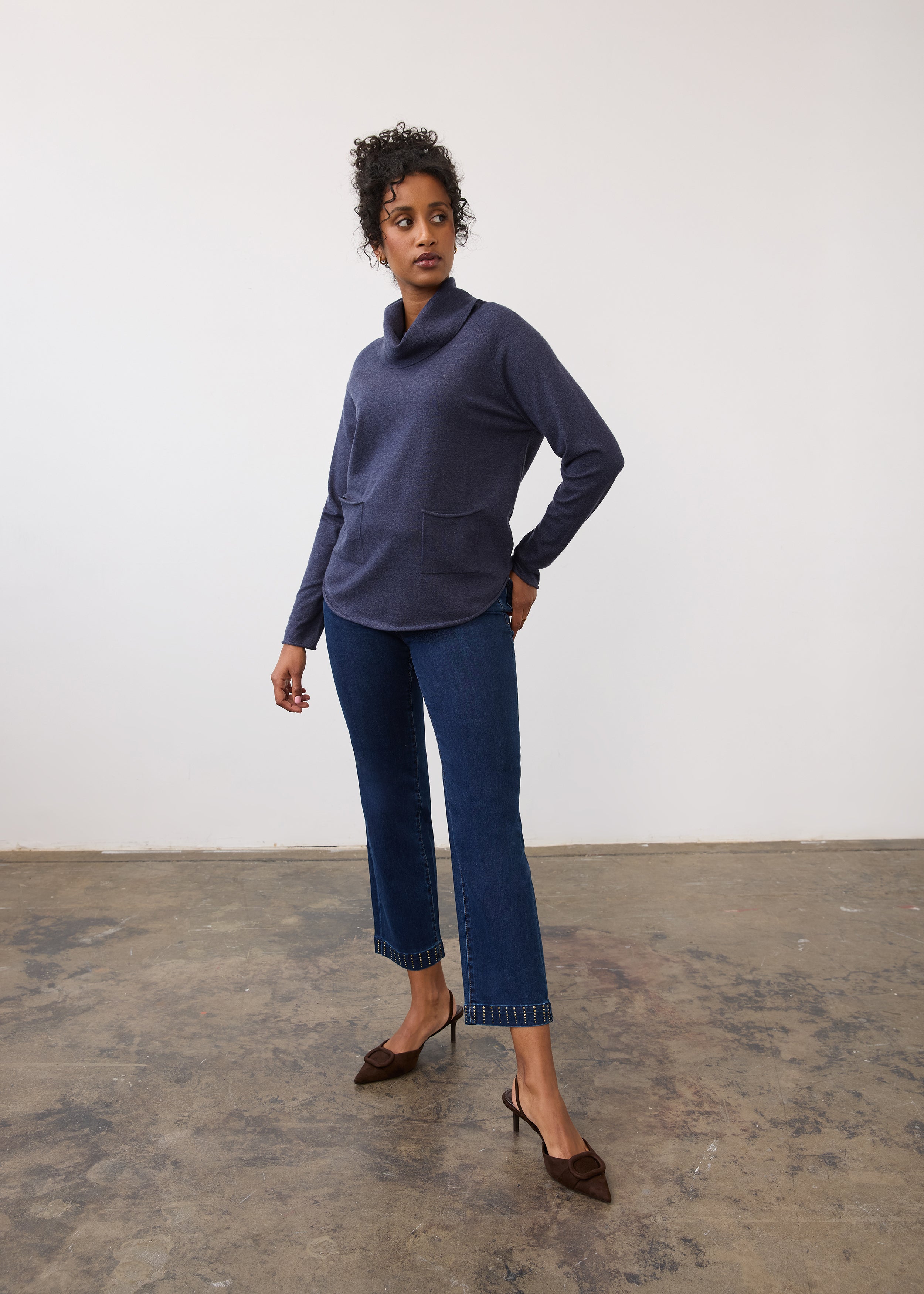 Full body view of navy sweater paired with jeans by French Dressing Jeans (FDJ)