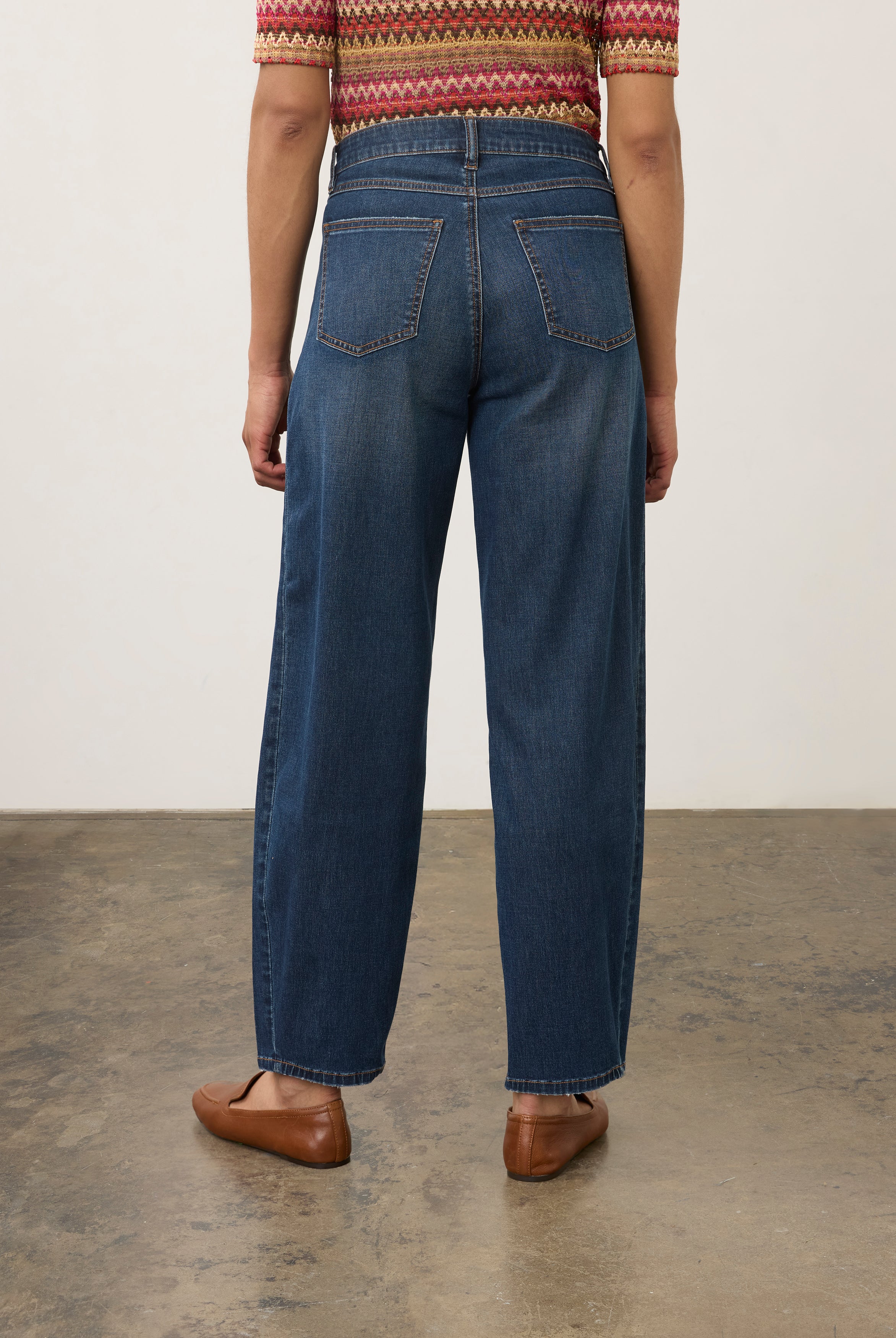 Back view of dark wash jeans with knit top, featuring back patch pockets by French Dressing Jeans (FDJ) par French Dressing Jeans (FDJ)