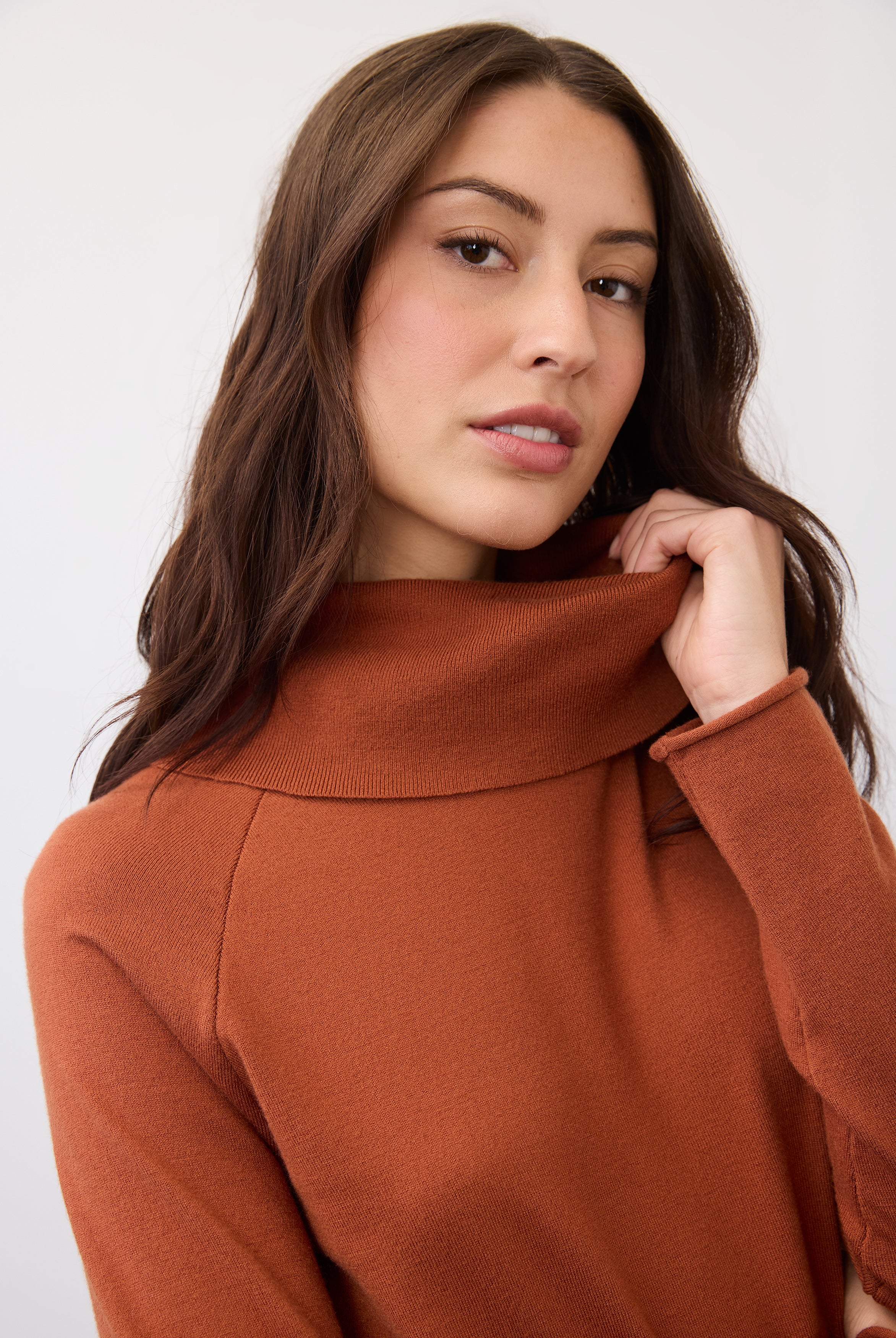 Close-up of cowl neck detail on rust sweater by French Dressing Jeans (FDJ)